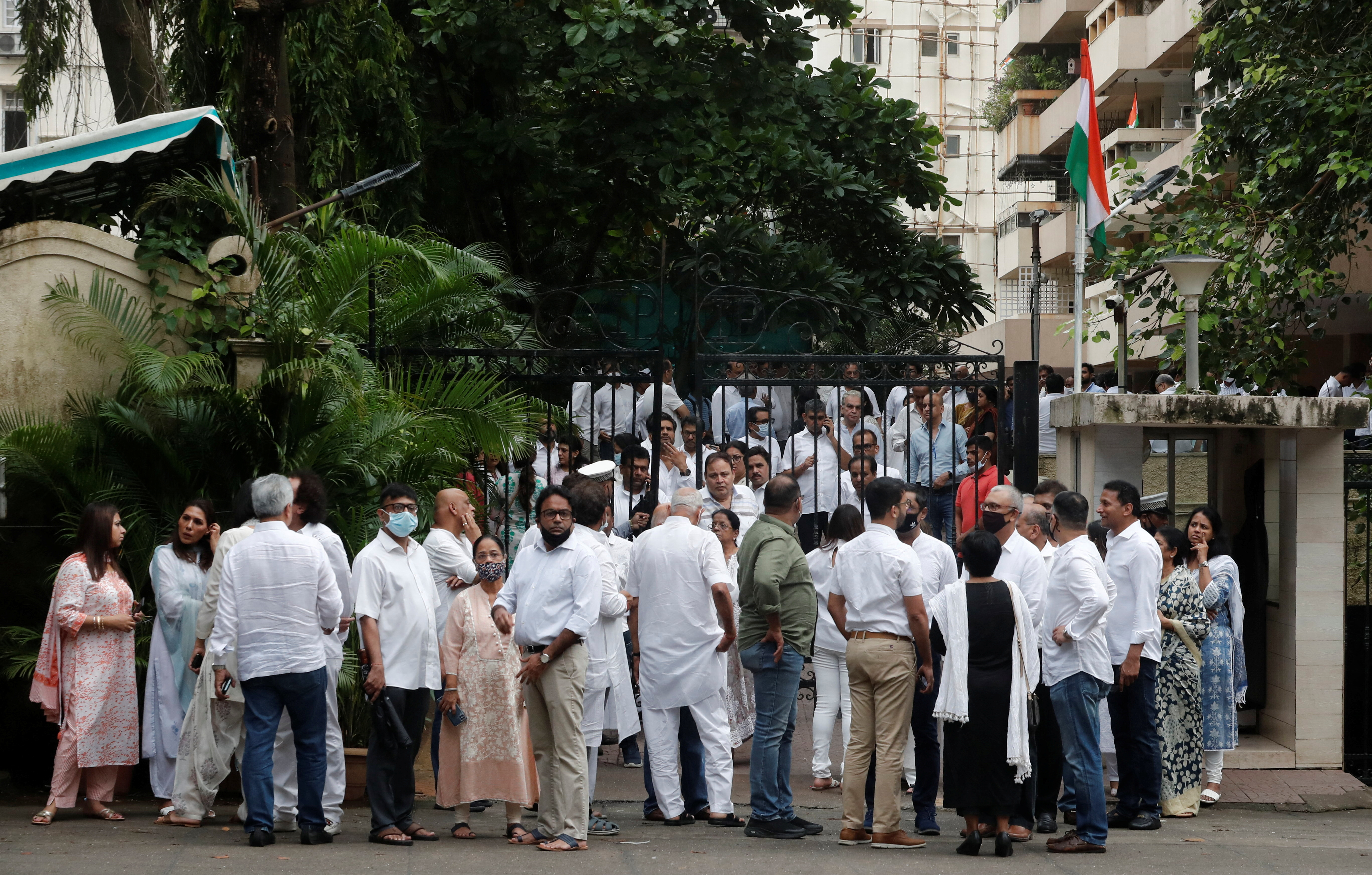 People are seen outside the residence of late Indian billionaire Rakesh Jhunjhunwala after his death in Mumbai, India today, August 14, 2022.  REUTERS/Francis Mascarenhas