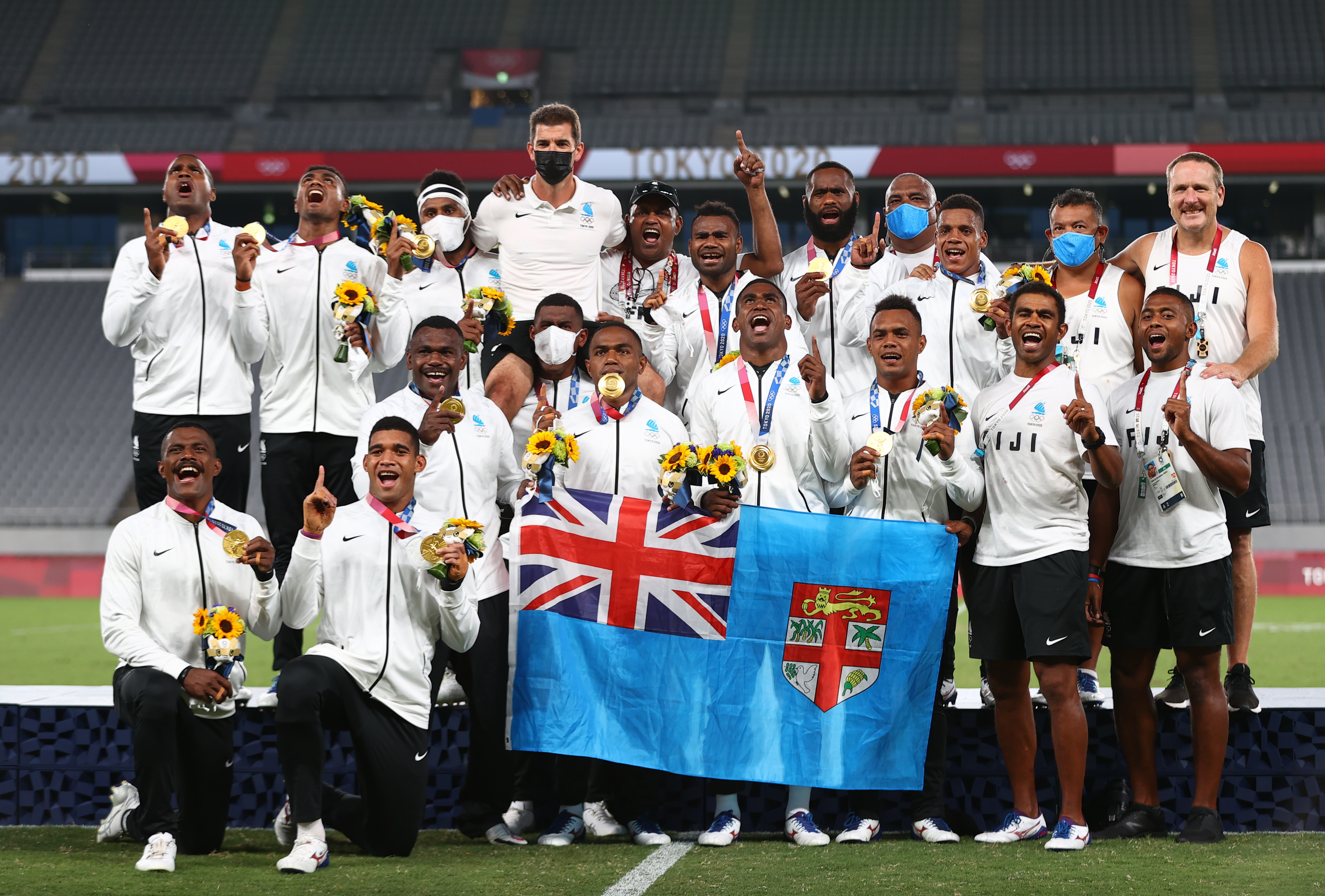 Tokyo 2020 Olympics - Rugby Sevens - Men - Medal Ceremony - Tokyo Stadium - Tokyo, Japan - July 28, 2021. Fiji players react after receiving gold medals. REUTERS/Siphiwe Sibeko