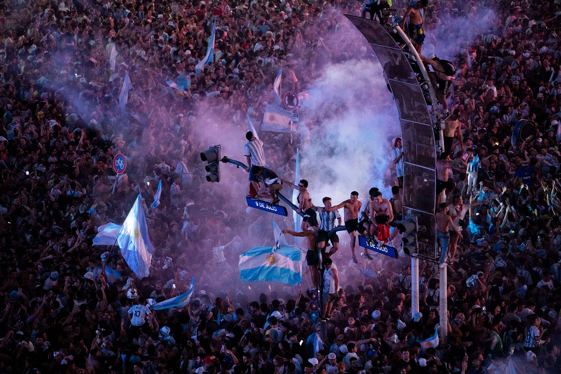 Argentine soccer fans celebrate their team's World Cup victory over France in downtown Buenos Aires, Argentina, Sunday, Dec. 18, 2022. (AP Photo/Rodrigo Abd)