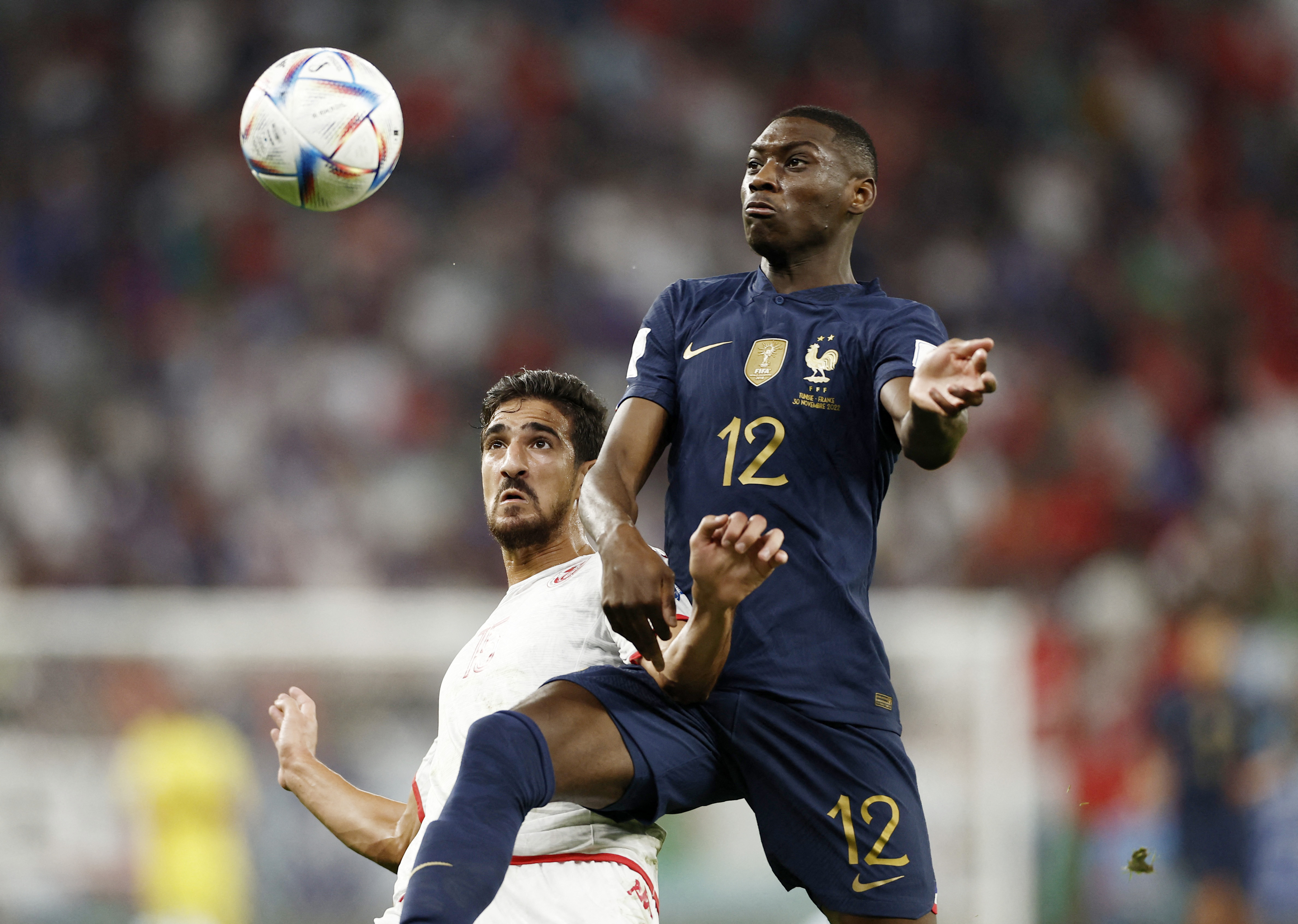 Soccer Football - FIFA World Cup Qatar 2022 - Group D - Tunisia v France - Education City Stadium, Al Rayyan, Qatar - November 30, 2022 France's Randal Solo Muani in action with Tunisia's Mohamed Ali Ben Romdhane REUTERS/Benoit Tessier