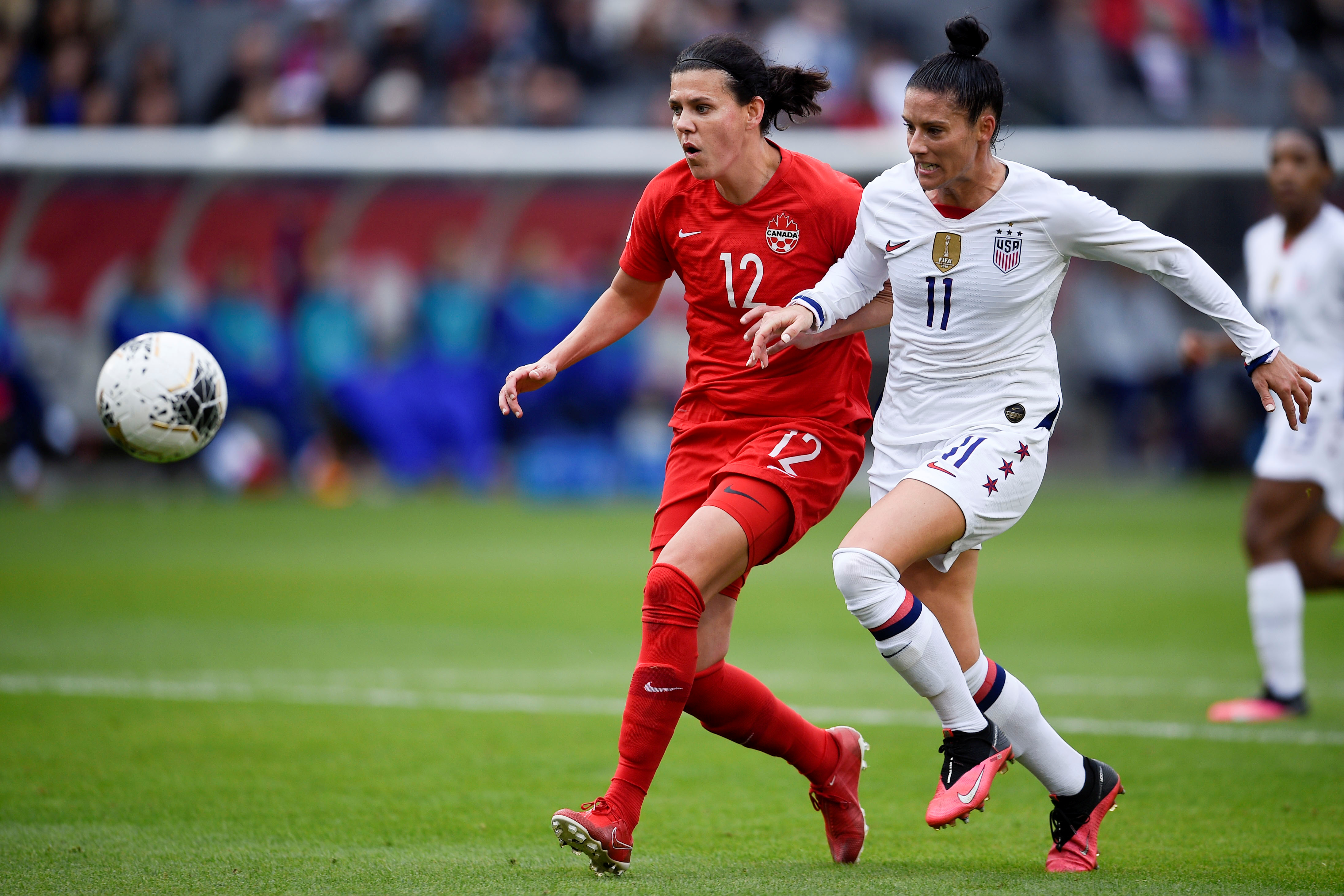 FILE PHOTO: Feb 9, 2020; Los Angeles, Colorado, USA; Canada forward Christine Sinclair (12) and United States defender Ali Krieger (11) chase down the ball during the first half of the CONCACAF Women's Olympic Qualifying soccer tournament at Dignity Health Sports Park. Mandatory Credit: Kelvin Kuo-USA TODAY Sports/File Photo