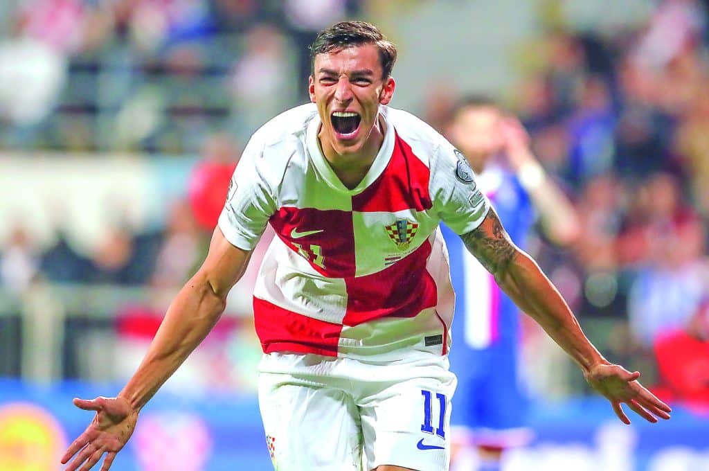 RIJEKA (Croatia), 14/11/2025.- Croatia's Petar Musa celebrates scoring the 2-1 goal during the FIFA World Cup 26 UEFA qualifier between Croatia and Faroe Islands in Rijeka, Croatia, 14 November 2025. (Mundial de Fútbol, Croacia, Islas Feroe) EFE/EPA/ANTONIO BAT
