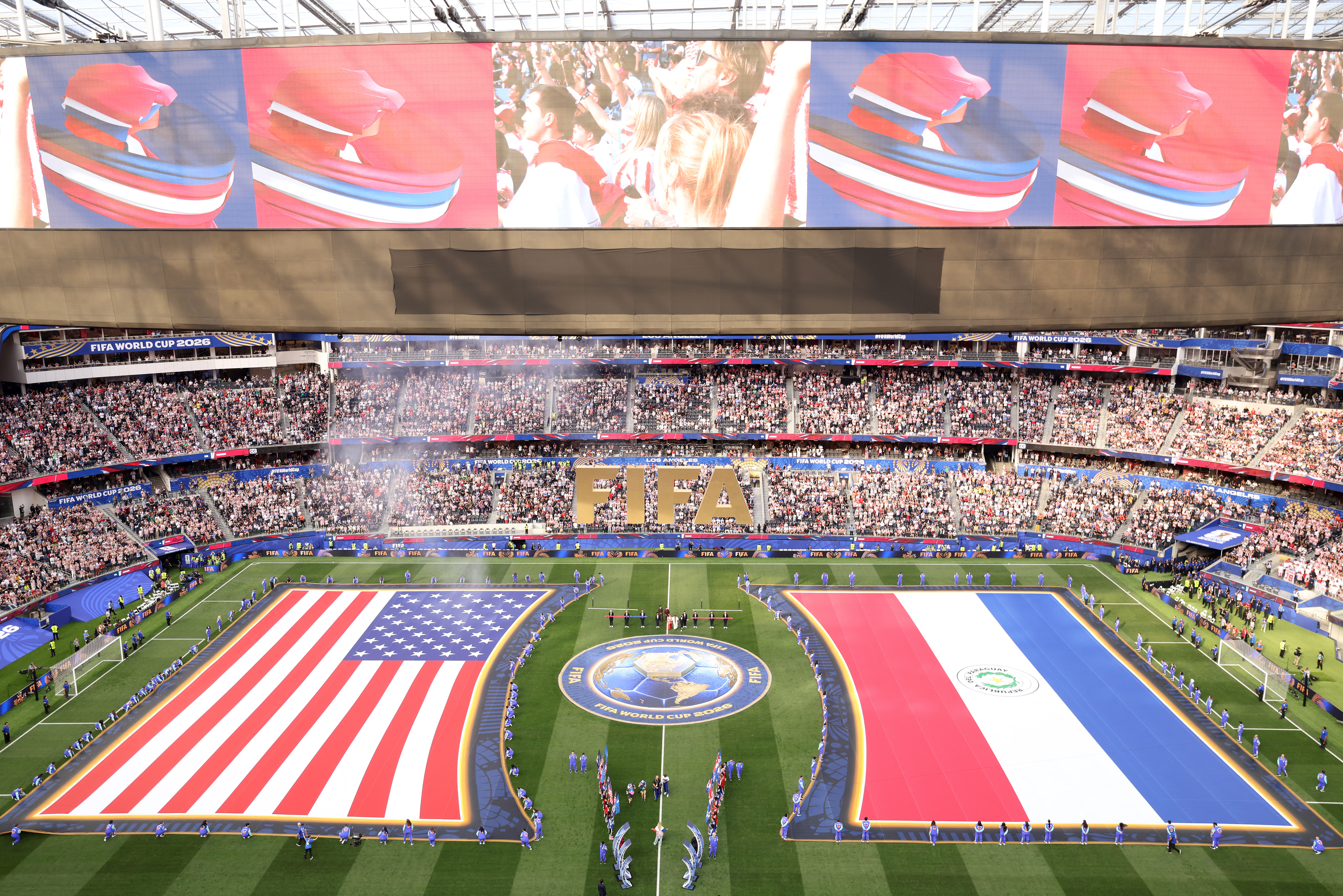 US and Paraguayan flags are seen ahead of the 2026 World Cup Group D football match between the USA and Paraguay at the Los Angeles Stadium in Inglewood on June 12, 2026. (Photo by Valerie MACON / AFP)