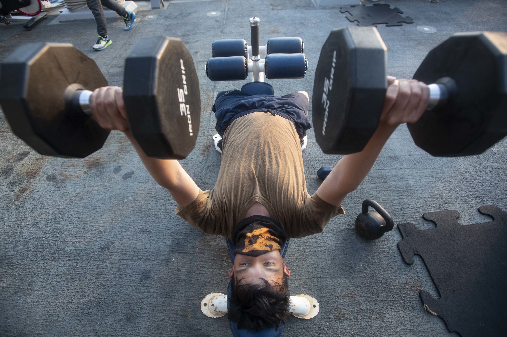 Boatswain's Mate Seaman Apprentice Esau Arellano, assigned to the Arleigh Burke-class guided-missile destroyer USS Ralph Johnson (DDG 114), engages in physical fitness while underway on Aug. 4, 2020, in the Arabian Gulf. (MC3 Anthony Collier/Navy)