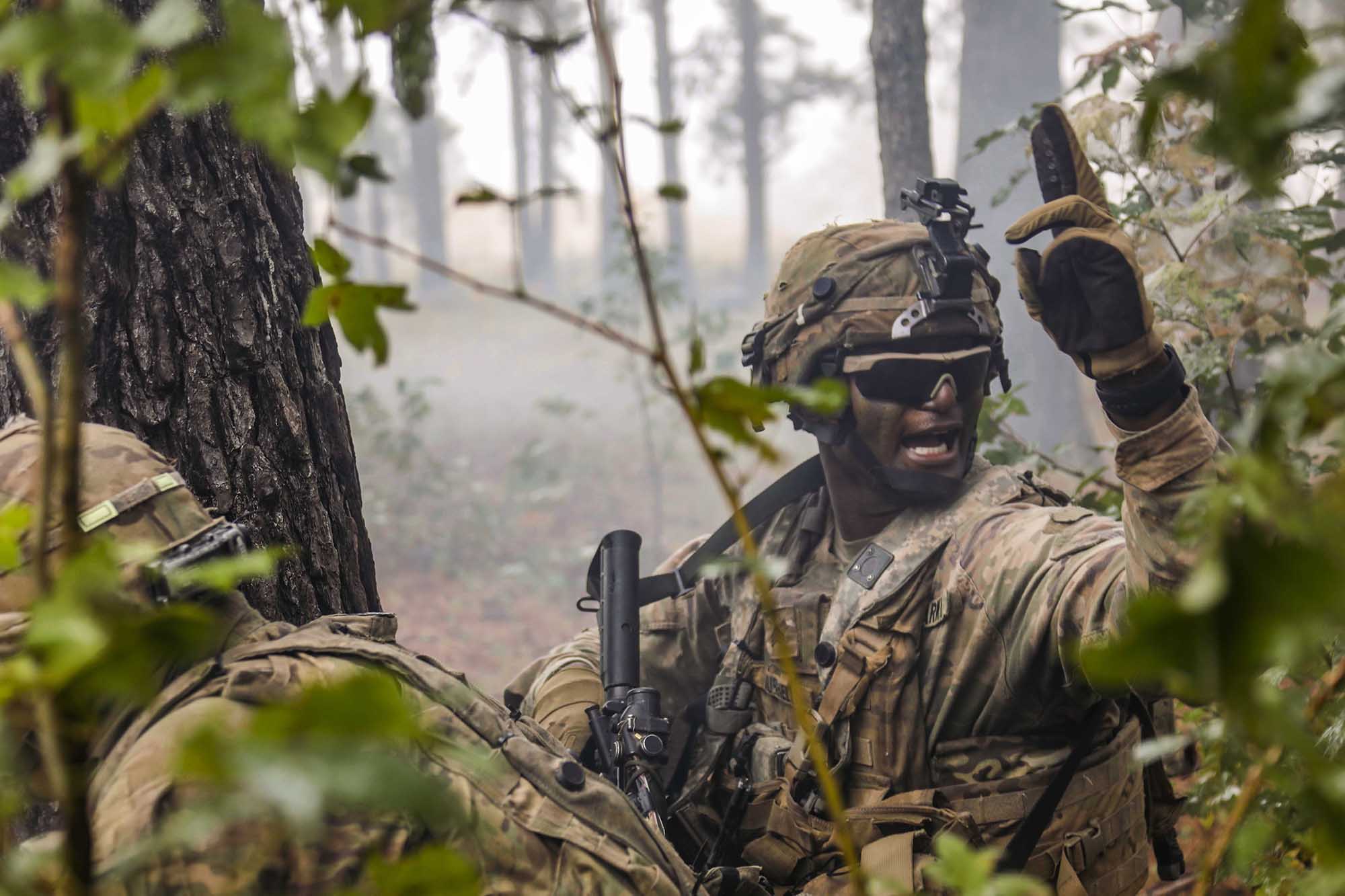 A combat engineer motions his team toward the breach point during the final live-fire exercise of rotation 21-01 on Oct. 27, 2020, at the Joint Readiness Training Center at Fort Polk, La. (Sgt. Thomas Calvert/Army)