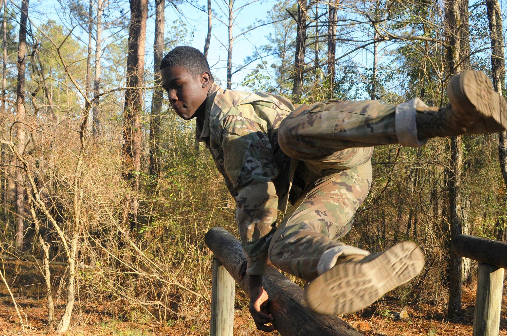 Pfc. Delcoy D. Delius powers through an obstacle course Jan. 23, 2021, as part of the 642nd Regional Support Group Best Warrior Competition at Fort McClellan, Ala. (Sgt. 1st Class Gary A. Witte/Army)