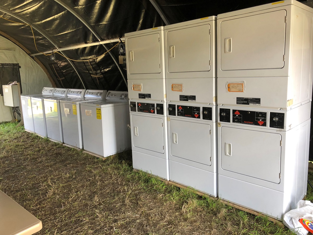 Over the course of the exercise, 87 trucks, two C-130J aircraft and a train moved the equivalent of 321 pallets of equipment into Krzesiny, Poland, by July 31. These washing machines were among that sent via C-130 to the 31st Air Base. (Valerie Insinna/Staff)