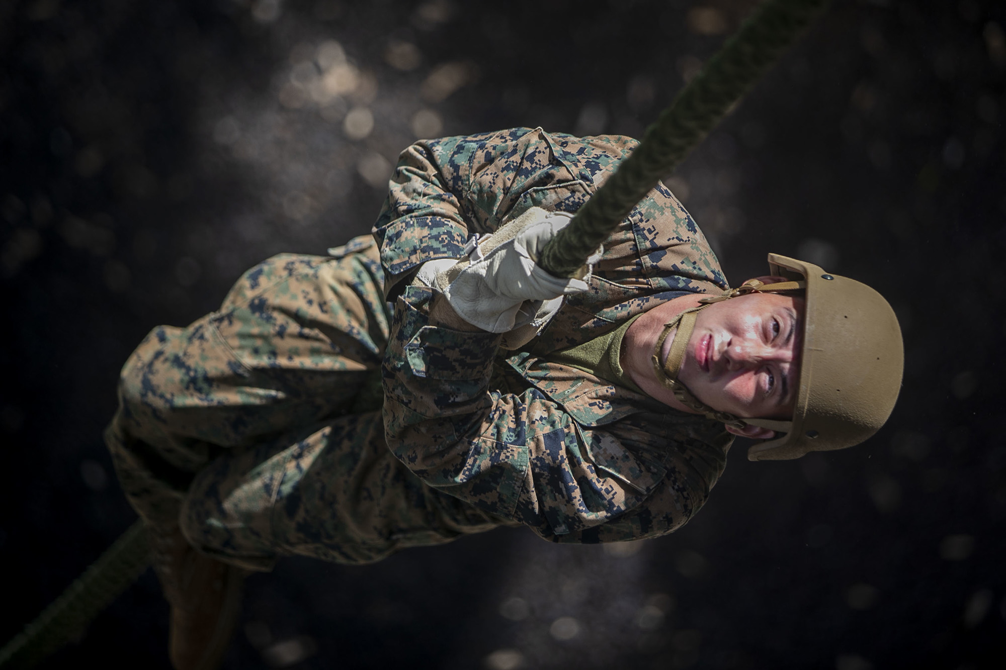 Marine Corps Lance. Cpl. Jonathen Figueroa conducts a fast roping exercise at the Lightning Academy, East Range Training Complex, Hawaii, Aug. 11, 2020. (Sgt. Luke Kuennen/Marine Corps)