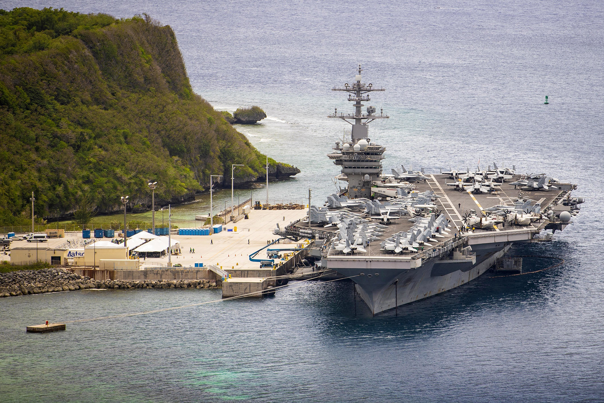 The aircraft carrier USS Theodore Roosevelt (CVN 71) is moored pier side at Naval Base Guam on May 15, 2020. (MC3 Conner D. Blake/Navy)
