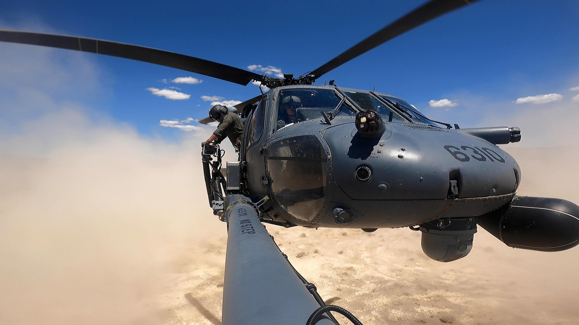 An HH-60G Pave Hawk lands during a training competition at the Nevada Test and Training Range, Nev., in this May 18, 2021, screen capture from video. (Airman 1st Class Zachary Rufus/Air Force)
