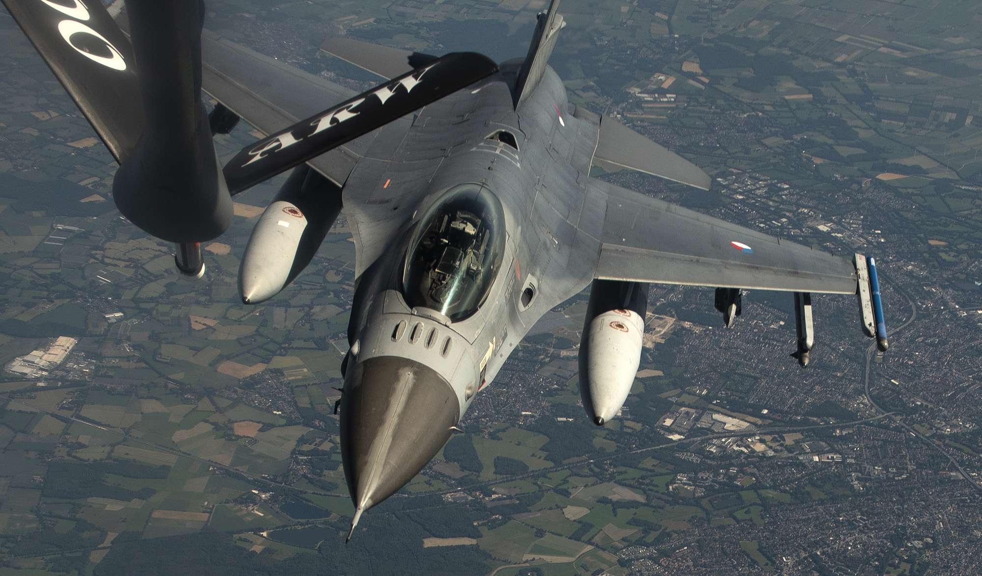 A Royal Netherlands air force F-16 Fighting Falcon approaches a U.S. Air Force KC-135 Stratotanker for refueling during a NATO Multinational Air Group exercise over Germany, June 25, 2020. (Airman 1st Class Jessi Monte/Air Force)
