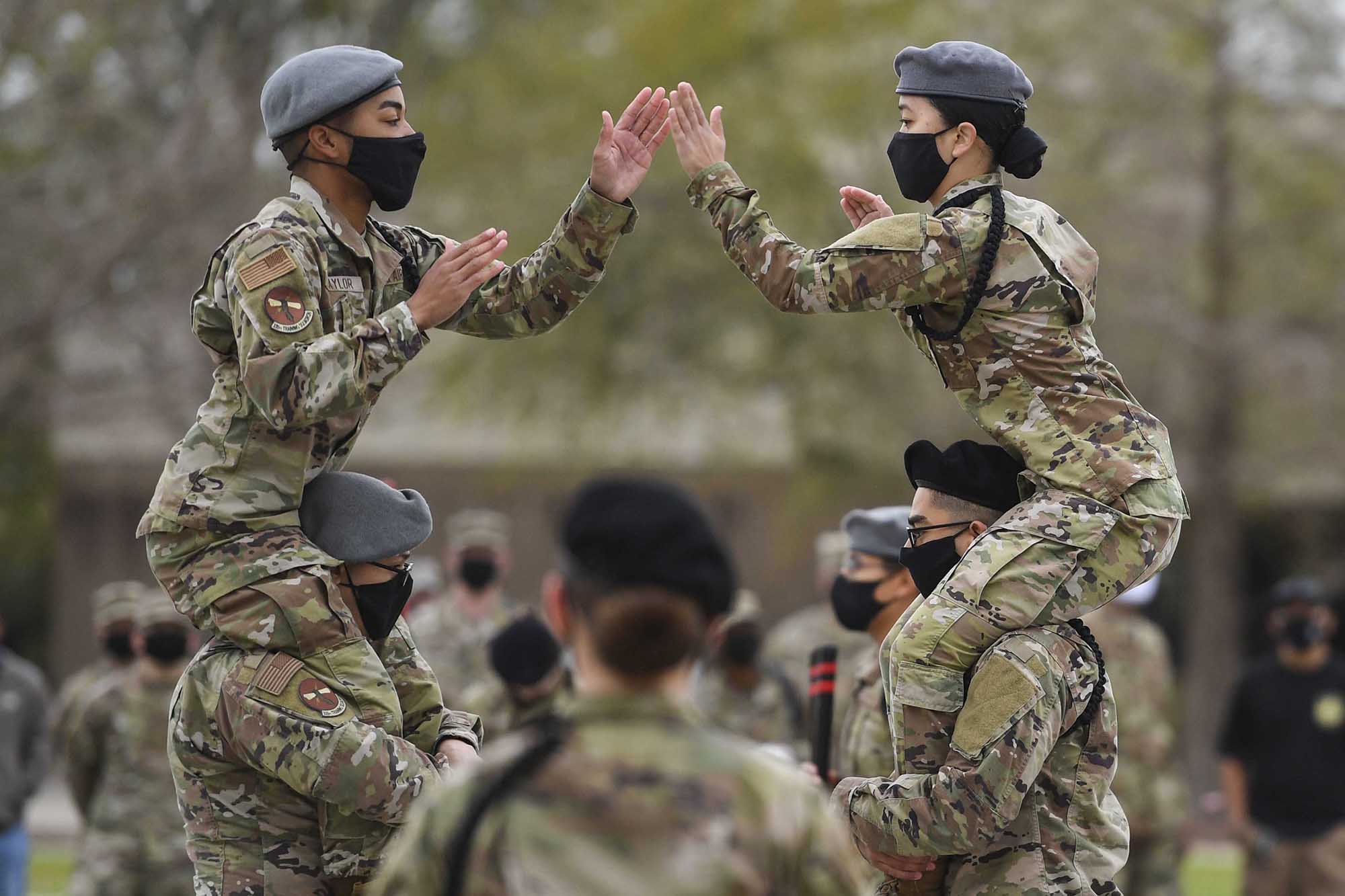 Airman 1st Class Tyrone Taylor and Airman Destiny Millerd, 335th Training Squadron freestyle drill team members, perform during the 81st Training Group drill down at Keesler Air Force Base, Miss., March 19, 2021. (Kemberly Groue/Air Force)