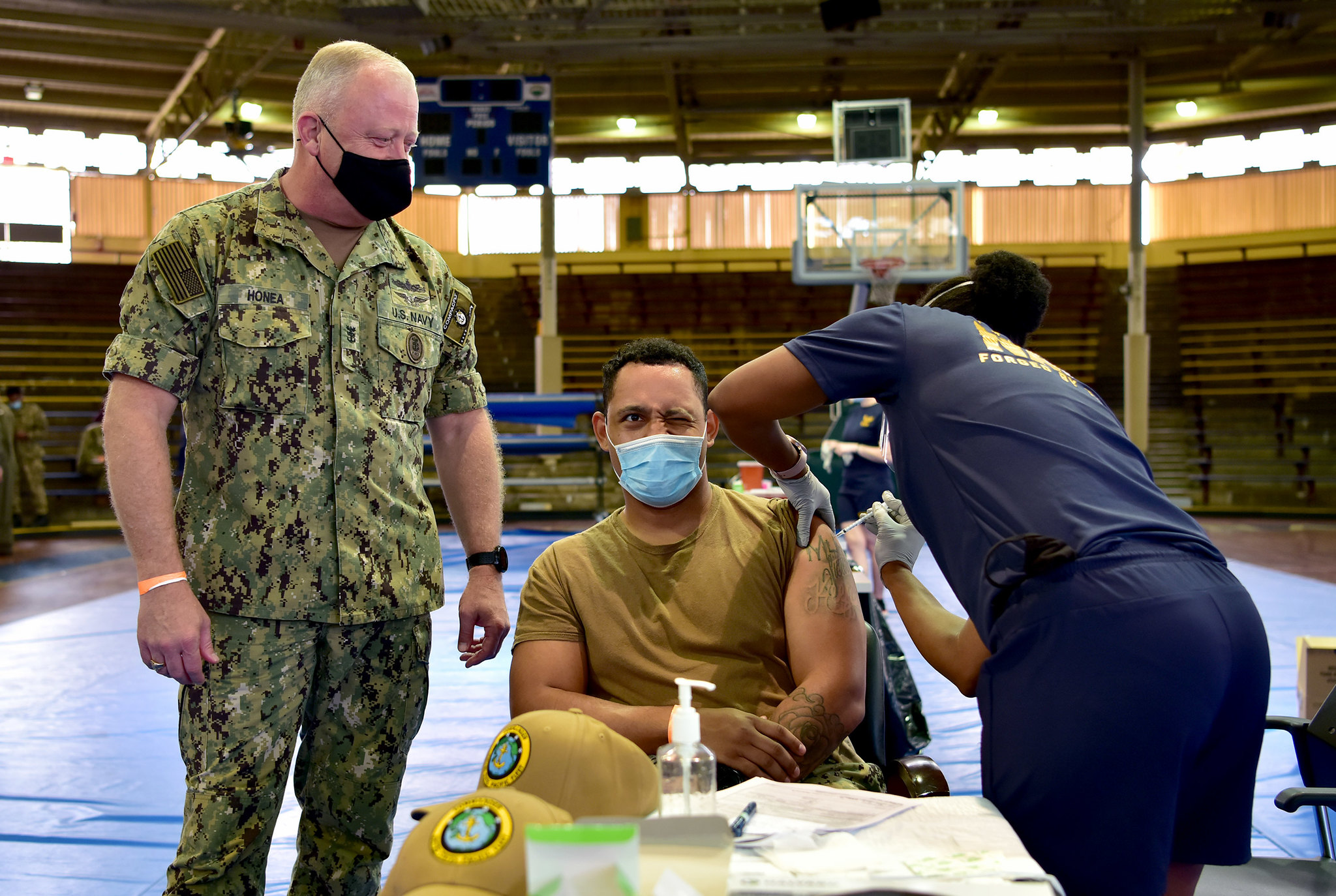 Master-at-Arms 1st Class Patrick Moore receives the COVID-19 vaccine as U.S. Pacific Fleet Fleet Master Chief James Honea observes at Joint Base Pearl Harbor-Hickam, Dec. 29, 2020. (Chief Mass Communication Specialist Jay C. Pugh/Navy)