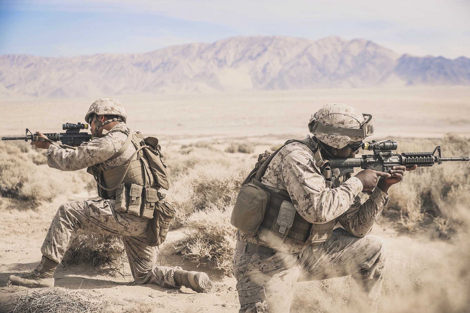 Cpl. Sathya Breckinridge and Lance Cpl. Keavious Blackmon provide cover during Integrated Training Exercise 1-21 at Marine Air Ground Combat Center Twentynine Palms, Calif., Oct. 5, 2020. (Lance Cpl. Zachary Zephir/Marine Corps)