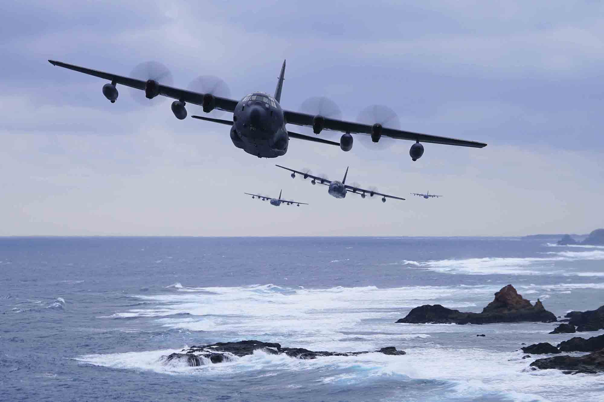 A formation of MC-130J Command IIs flies off the coast of Okinawa, Japan, on Jan. 6, 2021. (Capt. Renee Douglas/Air Force)