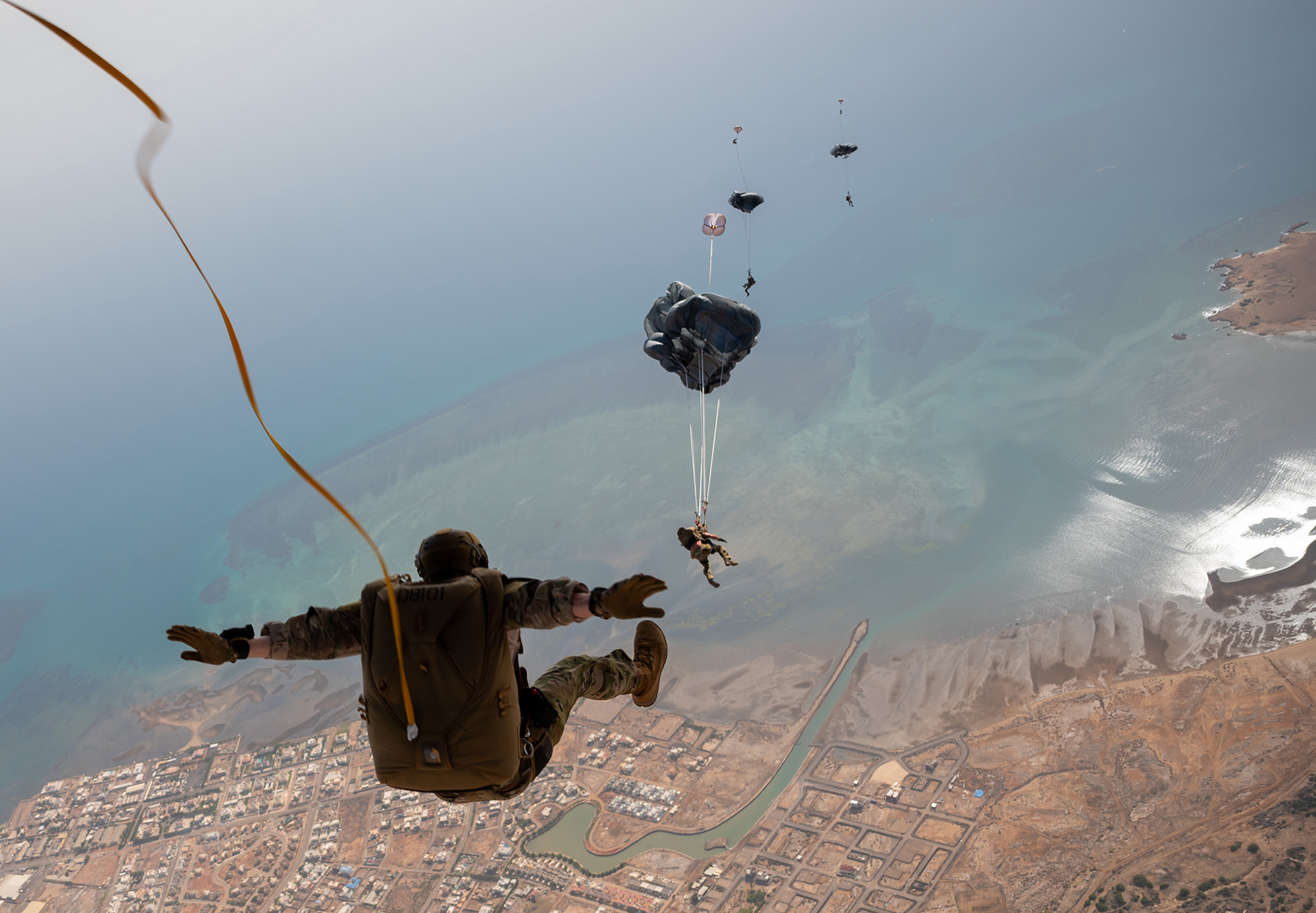 Pararescue airmen perform static line and military free-fall jumps from a Marine Aerial Refueler Transport Squadron-234 KC-130J over Djibouti, May 17, 2021. (Tech. Sgt. Daniel Asselta/Air Force)
