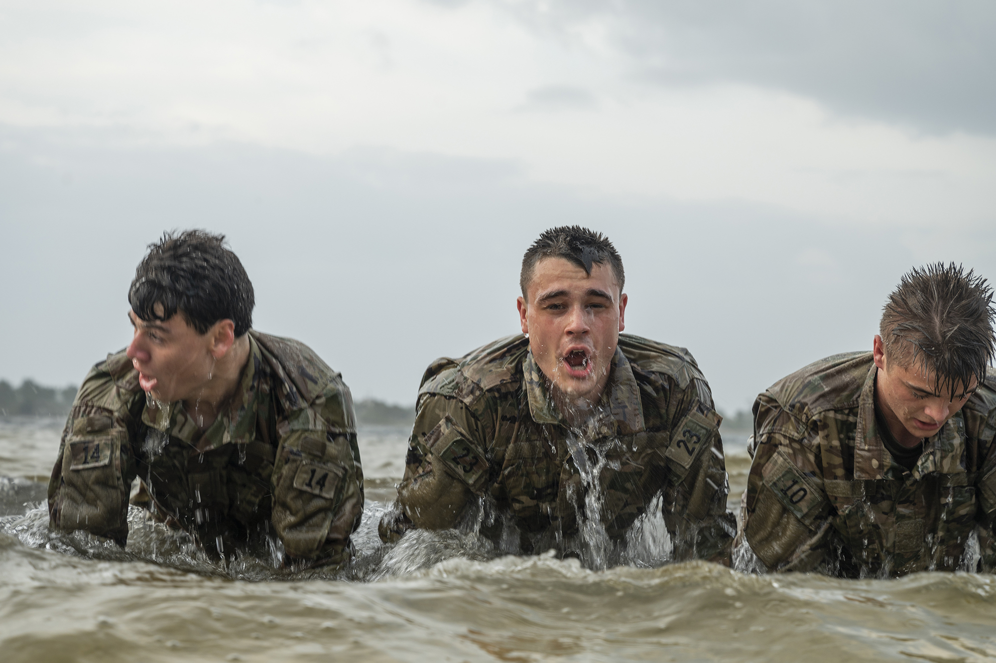 Air Force special tactics and combat rescue officer candidates perform push-ups in the water during an assessment and selection process at Hurlburt Field, Fla., March 25, 2021. (Tech. Sgt. Sandra Welch/Air Force)