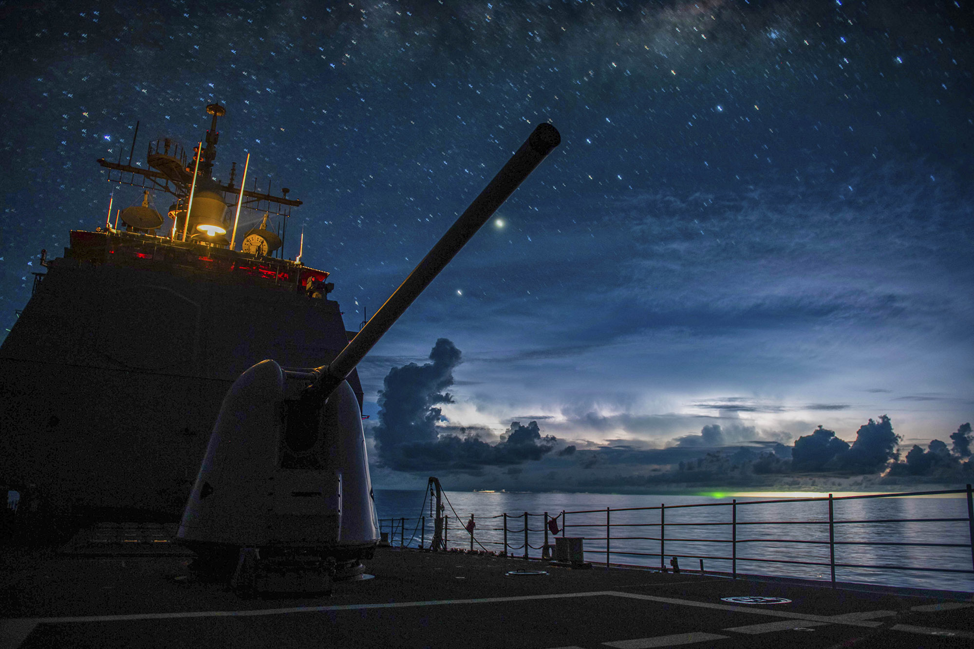 The Ticonderoga-class guided-missile cruiser USS Princeton (CG 59) steams through the night in the South China Sea on July 15, 2020. (MC2 Logan C. Kellums/Navy)