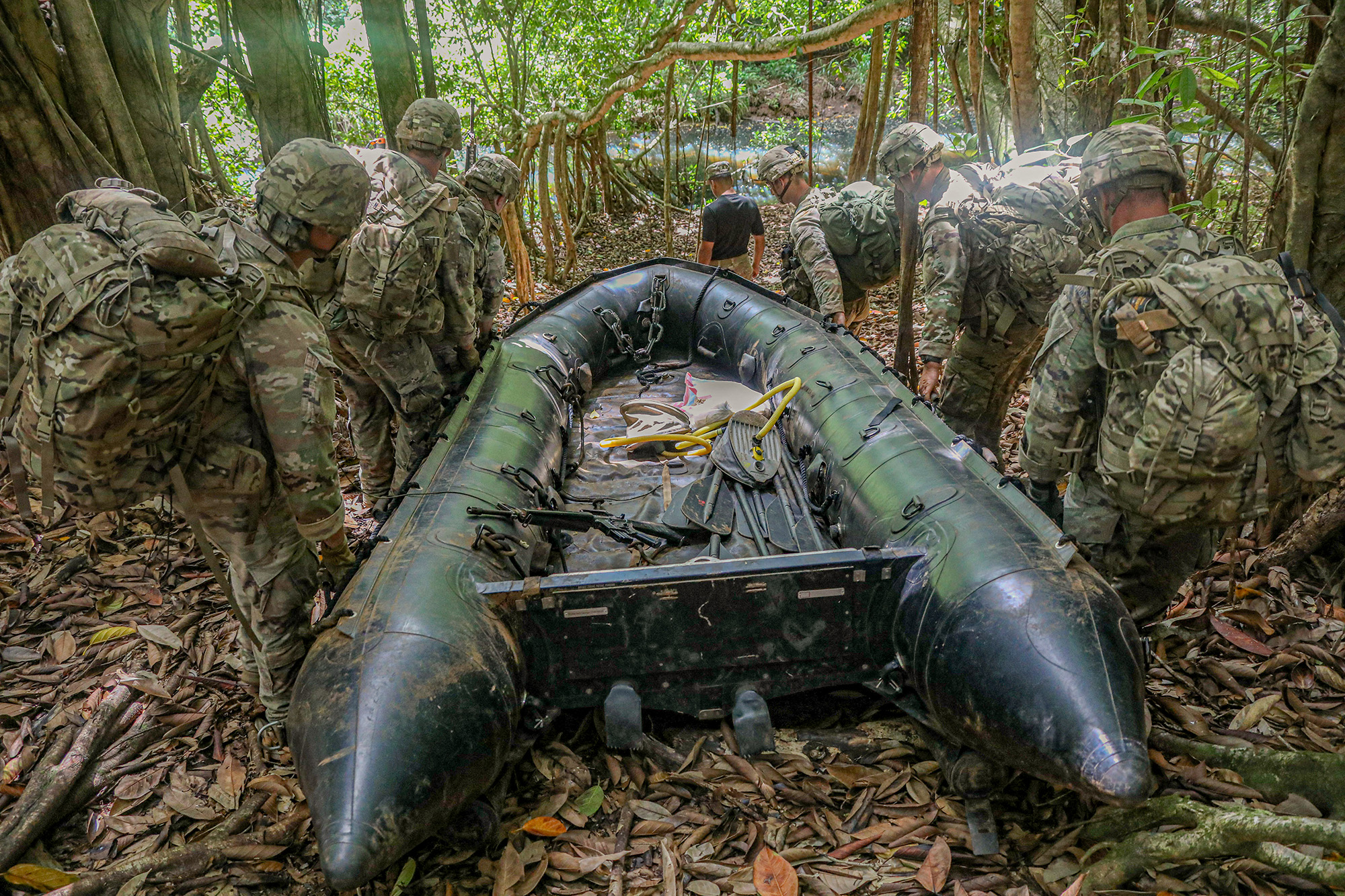 Soldiers assigned to the 25th Infantry Division conduct waterborne operations during patrol lanes at the Jungle Operations Training Course, Schofield Barracks East Range Training Complex, Hawaii, June 13, 2020. (Spc. Ezra Camarena/Army)