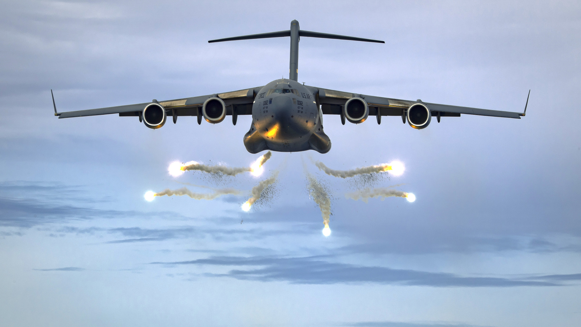 A C-17 Globemaster III deploys flares as part of a training event over the Atlantic Ocean in a military operating area outside Charleston, S.C., June 5, 2021. (Tech. Sgt. Chris Hibben/Air Force)