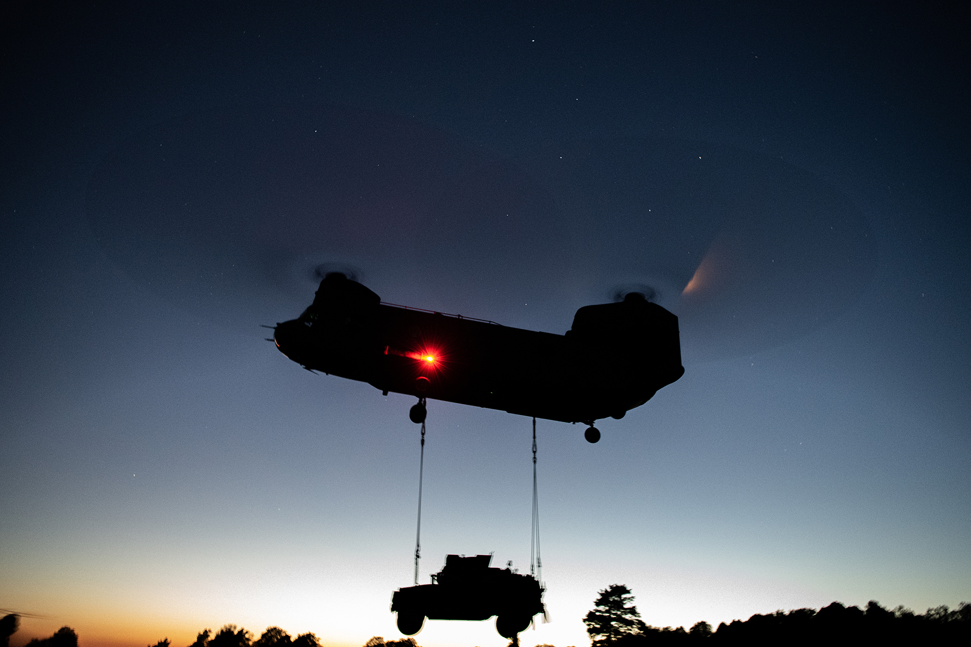 U.S. Army paratroopers perform night sling operations with a CH-47 Chinook in preparation for Exercise Saber Junction 20 on Aug. 5, 2020, as part of the 173rd Brigade Field Training Exercise in Grafenwoehr Training Area, Germany. (Sgt. John Yountz/Army)