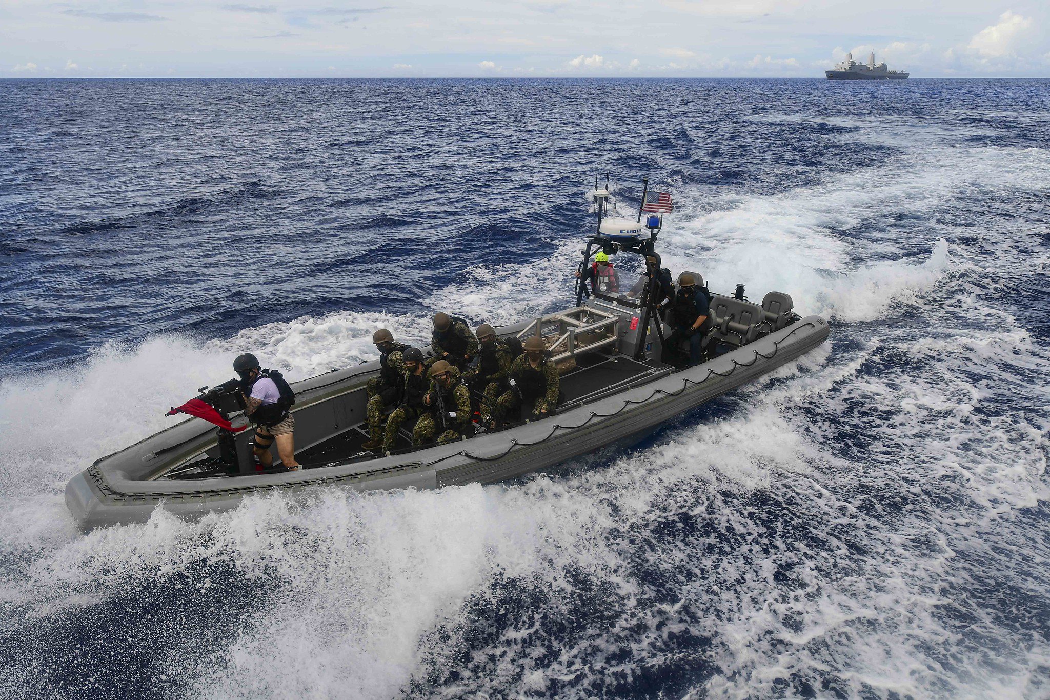 A visit, board, search and seizure team from the amphibious transport dock ship USS New Orleans (LPD 18) approaches a simulated suspect vessel during a training exercise Sept. 16, 2020, in the Philippine Sea. (MC2 Kelby Sanders/Navy)