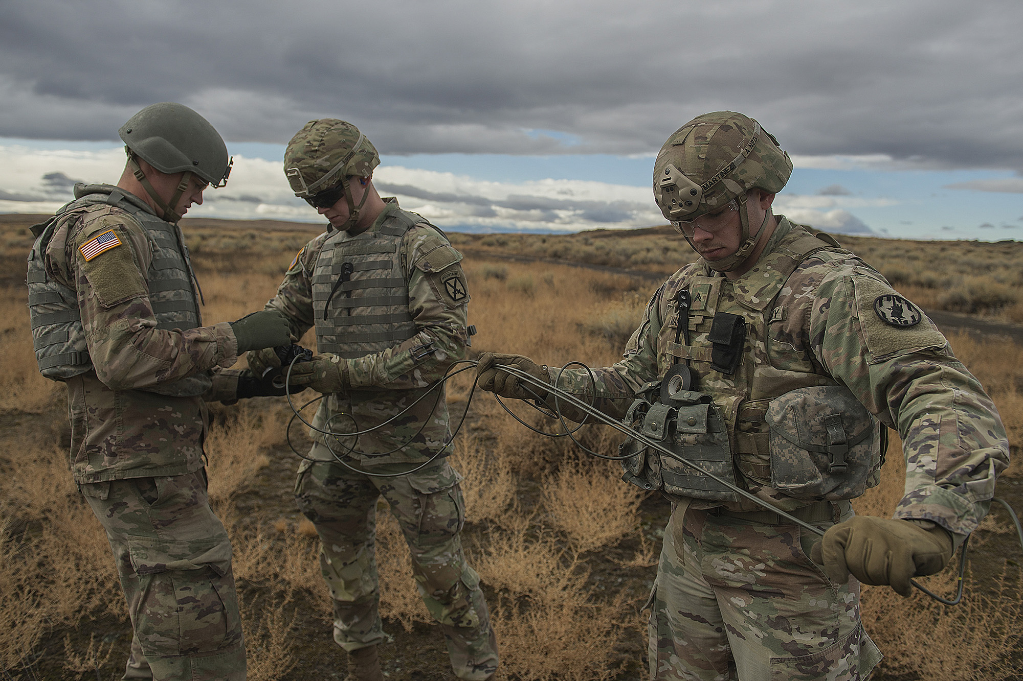 Army Spcs. Timothy Martin, left, and Shane Flores, middle, and Cpl. Dario Martinez prepare for a detonation during training in Boise, Idaho, Nov. 18, 2020. (Thomas Alvarez/Army)