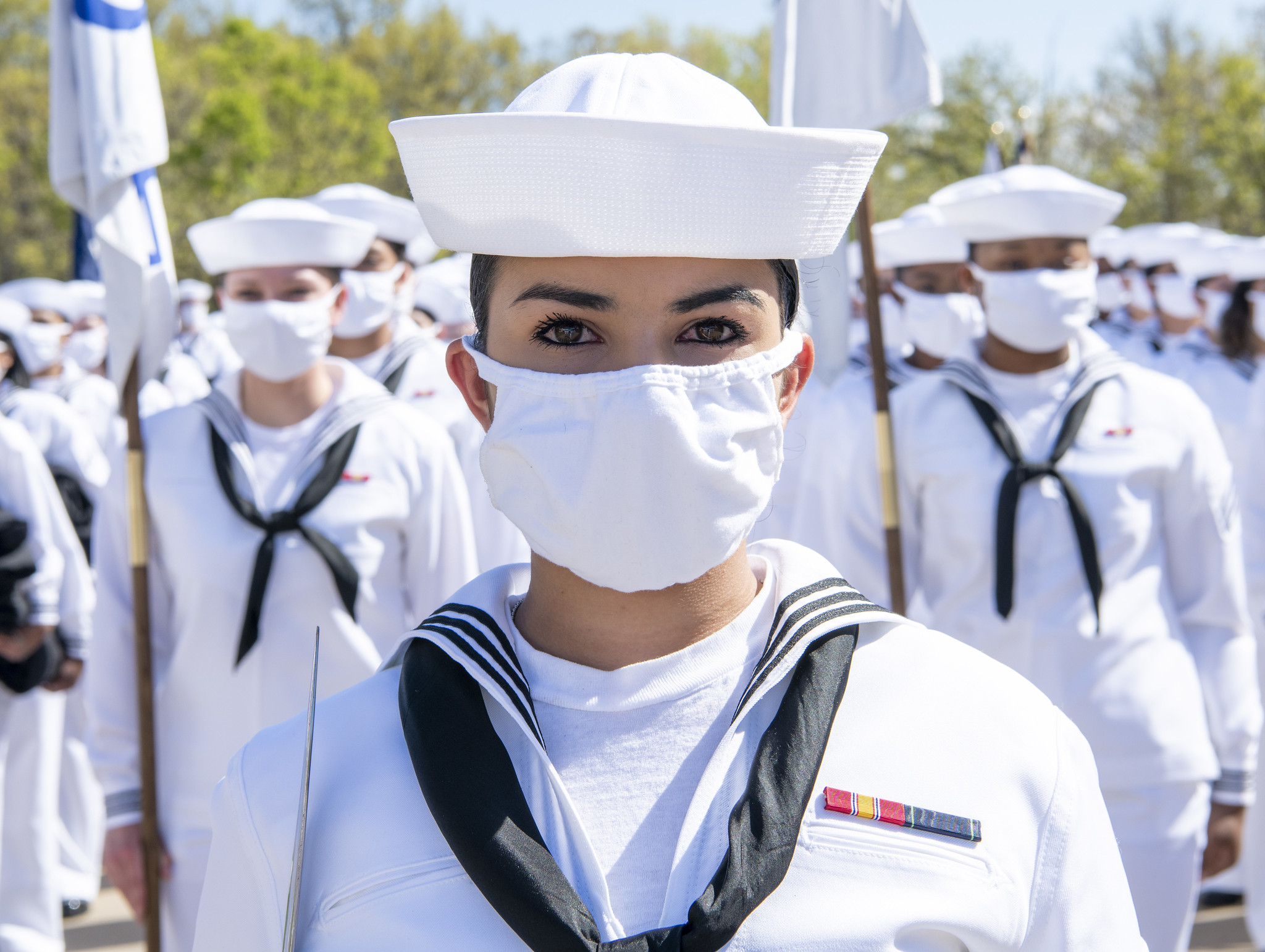 A recruit chief petty officer stands at the lead of her formation May 13, 2021, before there pass-in-review graduations ceremony at Recruit Training Command at Great Lakes, Ill. (MC1 Spencer Fling/Navy)