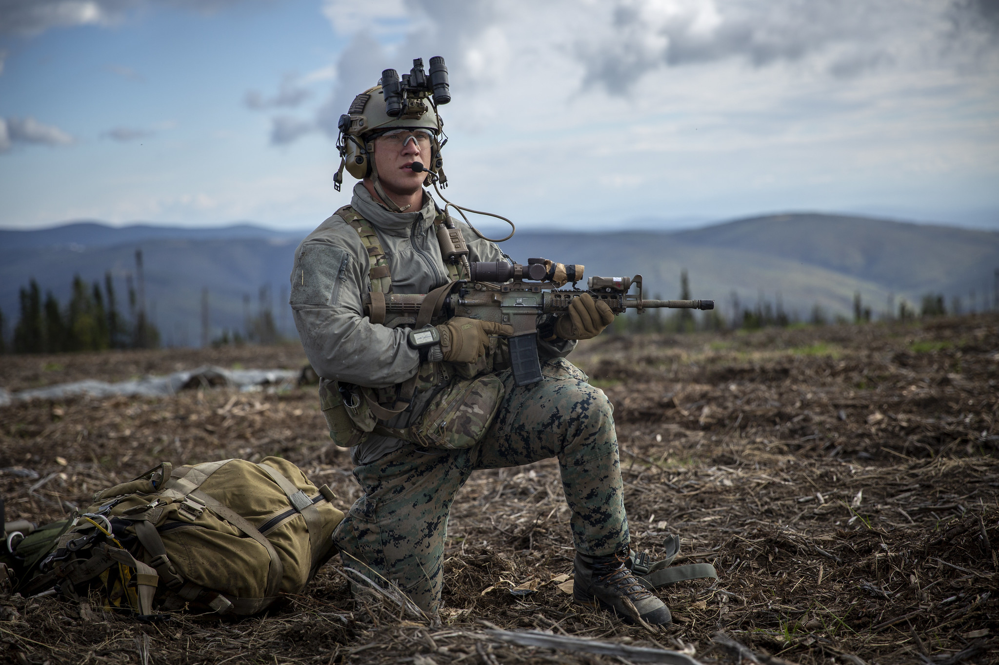 Hospital Corpsman 3rd Class Wayne Jaworski provides security after completing a free-fall insert during a Marine Corps combat readiness evaluation at Eielson Air Force Base, Alaska, Aug. 21, 2020. (Cpl. Israel Chincio/Marine Corps)