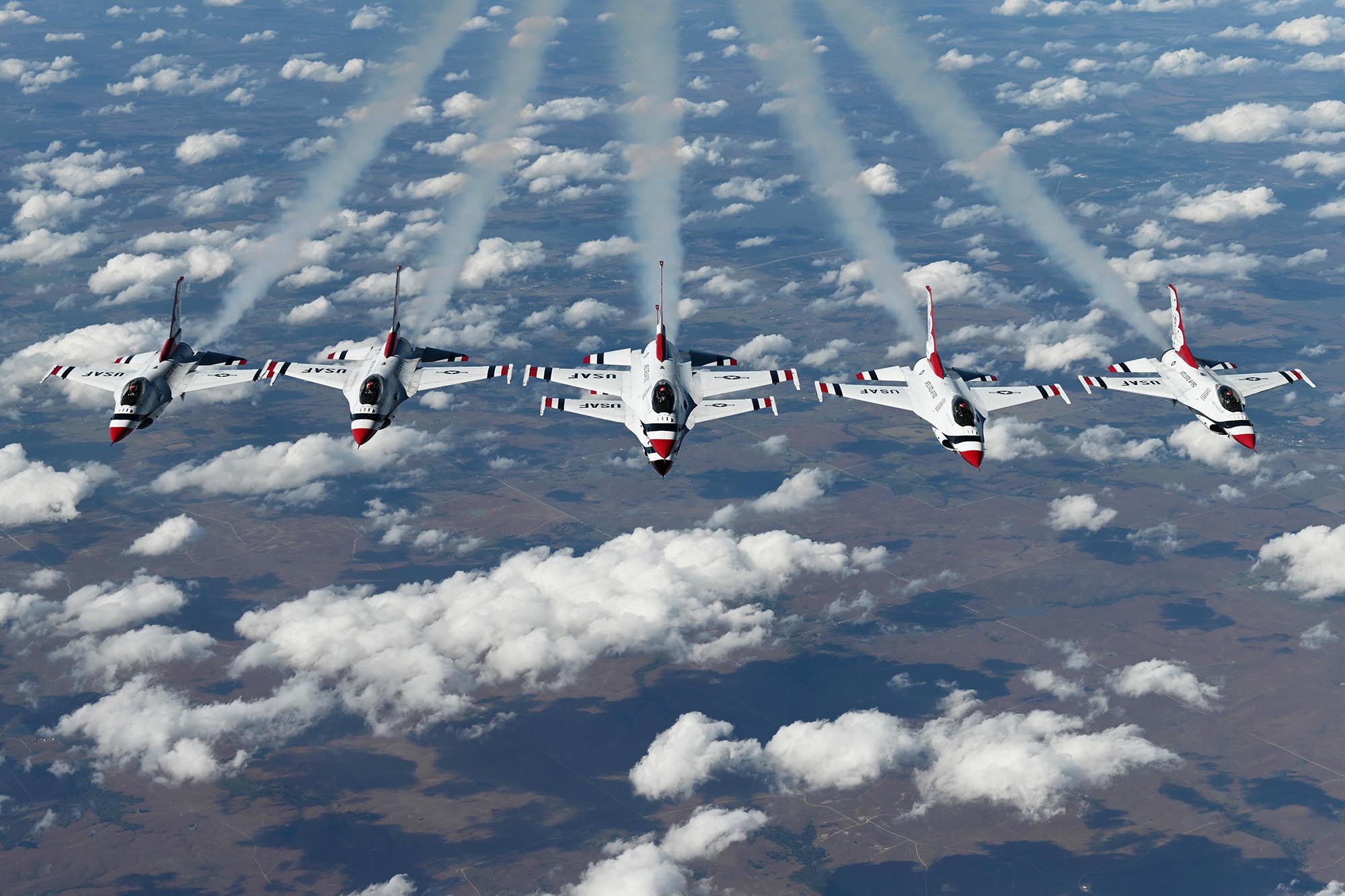The U.S. Air Force Thunderbirds perform a six-ship formation under a KC-10 Extender, Oct. 22, 2020, over Oklahoma. (Senior Airman Jonathon Carnell/Air Force)