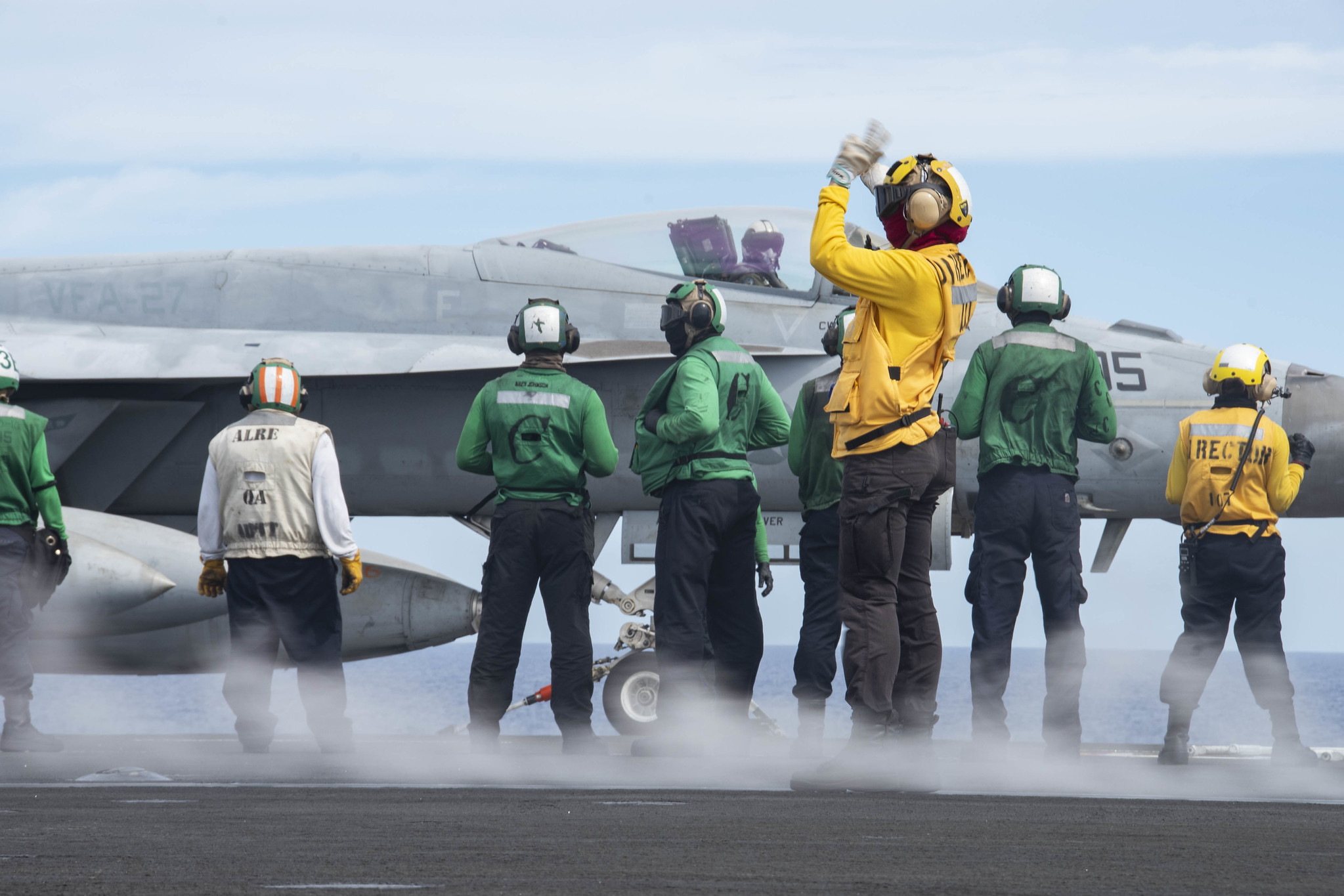 Sailors prepare to launch an F/A-18E Super Hornet on the flight deck of the aircraft carrier USS Ronald Reagan (CVN 76) on June 18, 2020, during flight operations in the Philippine Sea. (MC3 Erica Bechard/Navy)