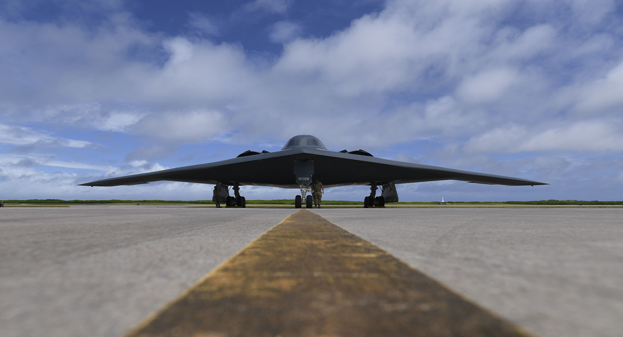 Senior Airman Robert Witkowski and Staff Sgt. Mark Farrar, 393rd Expeditionary Bomb Squadron crew chiefs, deployed from Whiteman Air Force Base, Mo., prepare a B-2 Spirit for takeoff at Naval Support Facility Diego Garcia in support of a Bomber Task Force mission, Aug. 17, 2020. (Tech. Sgt. Heather Salaza/Air Force)