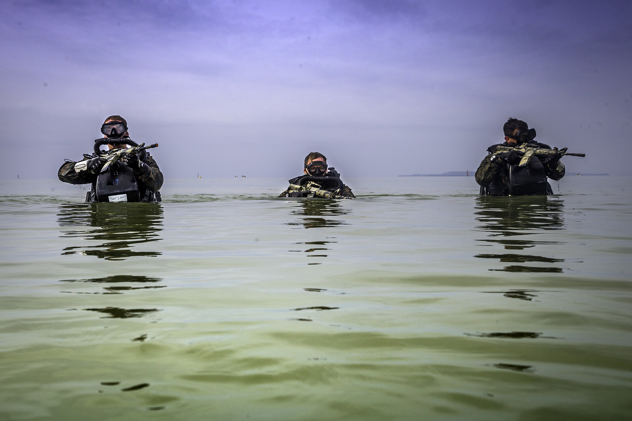 U.S. Marines patrol through water during a Marine Corps Combat Diving Supervisors Course on Camp Schwab, Okinawa, Japan, May 20, 2020. (Cpl. Savannah Mesimer/Marine Corps)