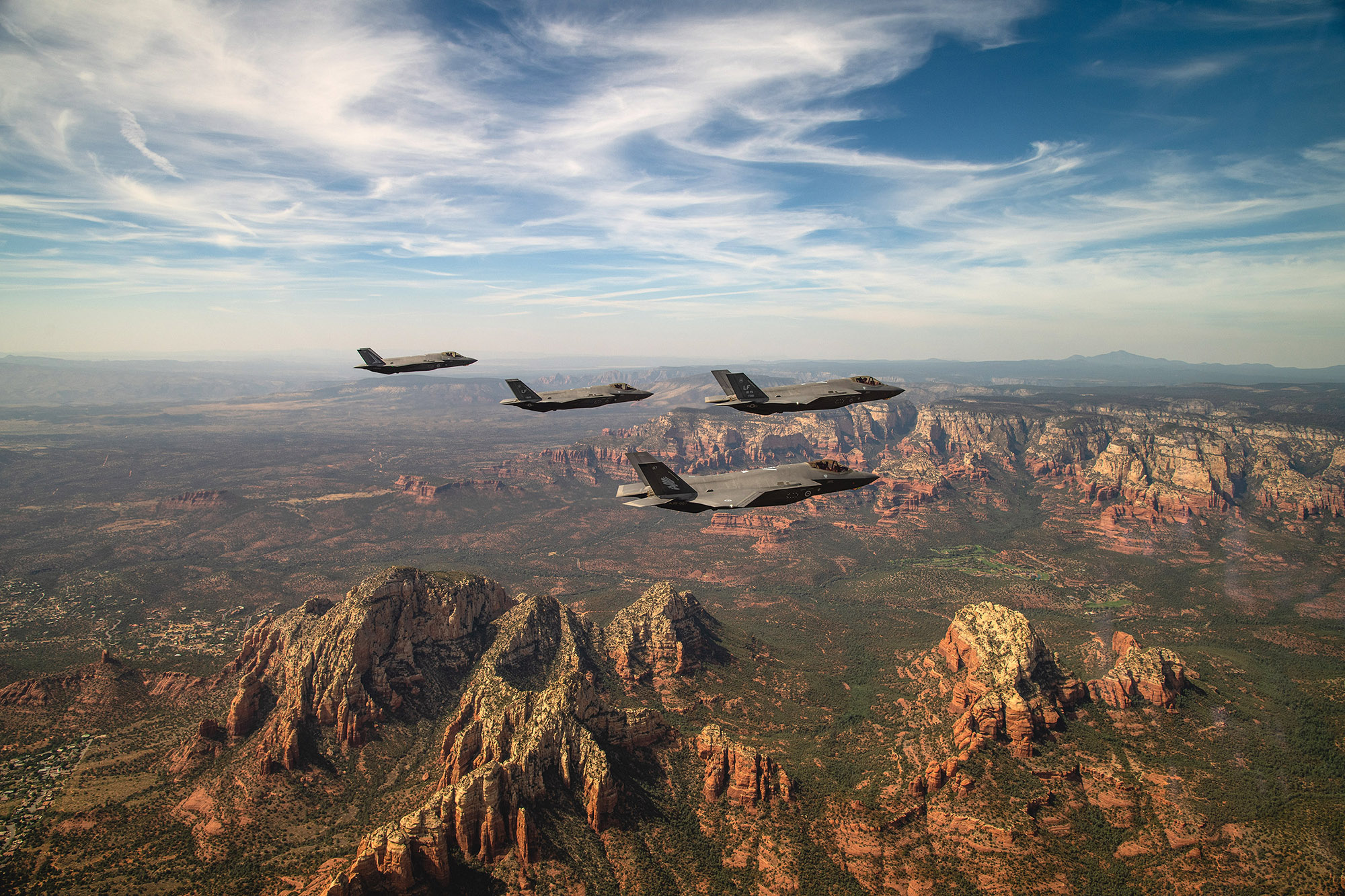 Two U.S. Air Force and two Royal Australian Air Force F-35A Lightning II’s fly in formation during a commemoration flight Oct. 8, 2020, over Sedona, Ariz. The flight celebrated the partnership between the RAAF and U.S. Air Force in their joint efforts in training the world’s most capable fighter pilots at Luke AFB. (Staff Sgt. Alexander Cook/Air Force)
