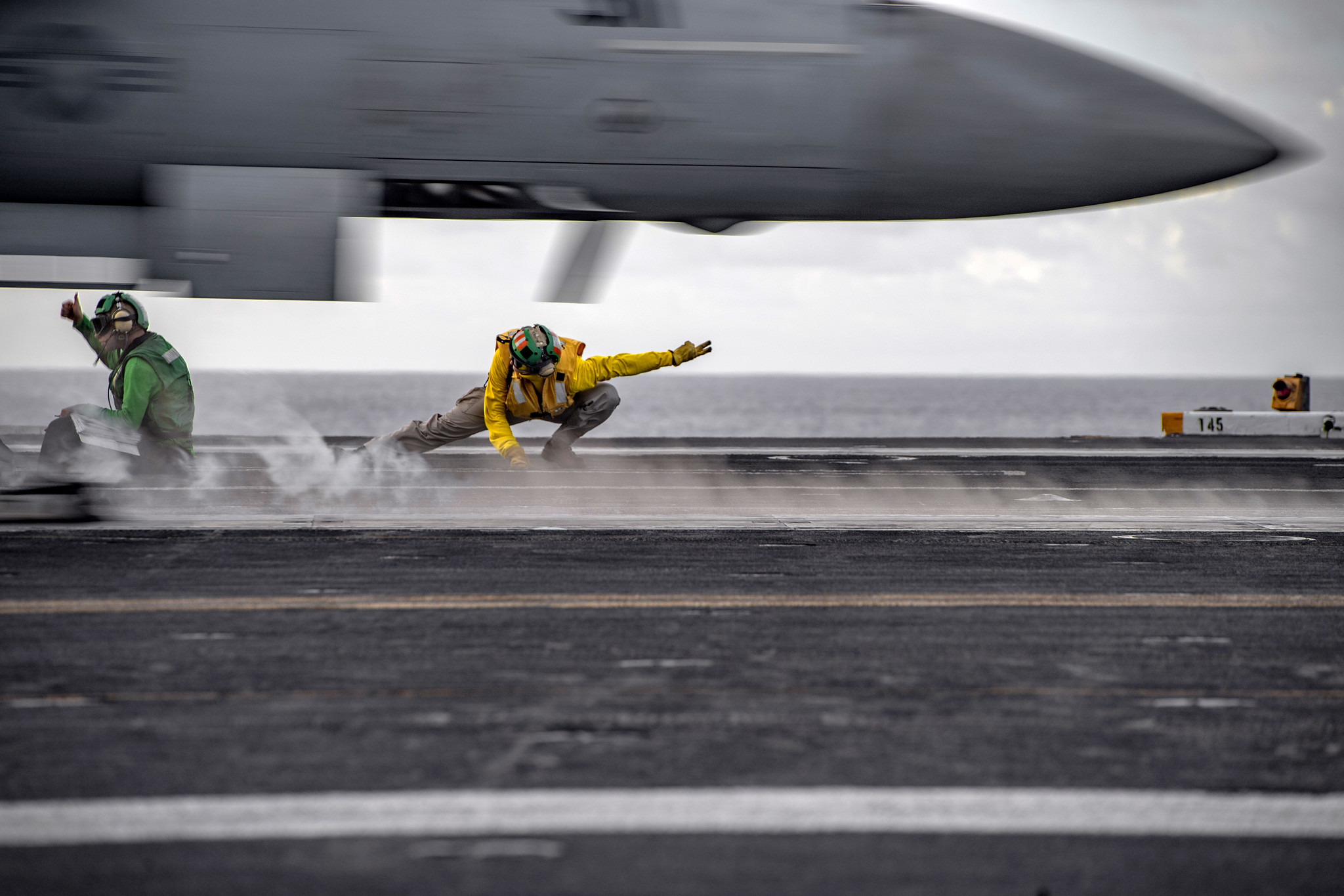 Sailors conduct flight operations aboard the aircraft carrier USS Nimitz (CVN 68) on June 28, 2020, in the Philippine Sea. The Nimitz and Ronald Reagan Carrier Strike Groups are conducting dual carrier operations in the Indo-Pacific as the Nimitz Carrier Strike Force. (MC3 Kyle Merritt/Navy)