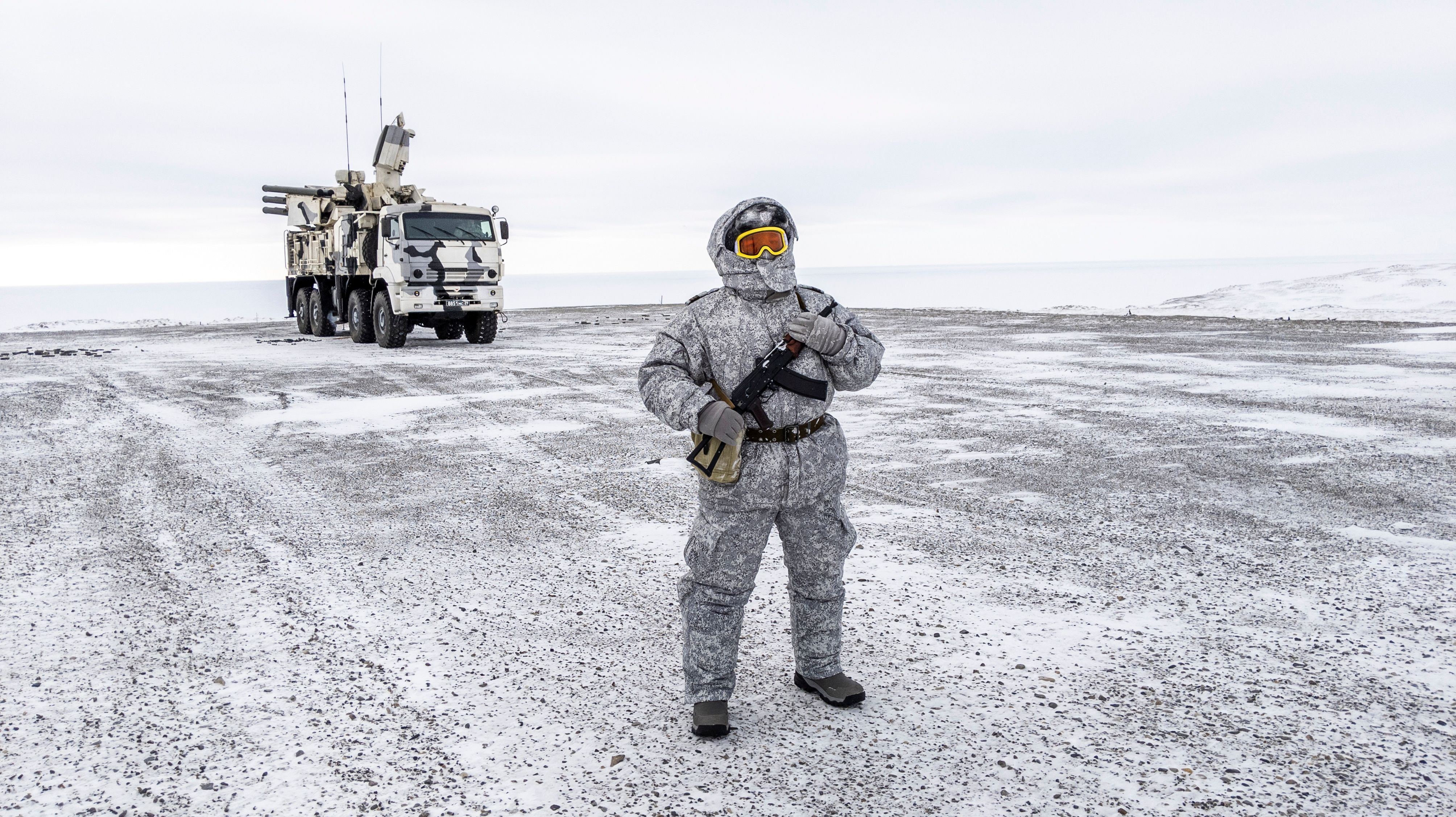A soldier holds a machine gun as he patrols the Russian northern military base on Kotelny island, beyond the Arctic circle on April 3, 2019. The Arctic is a strategic region for Russia as it continues to strengthen its presence with the new perspectives offered by global warming. (Maxime Popov/AFP via Getty Images)