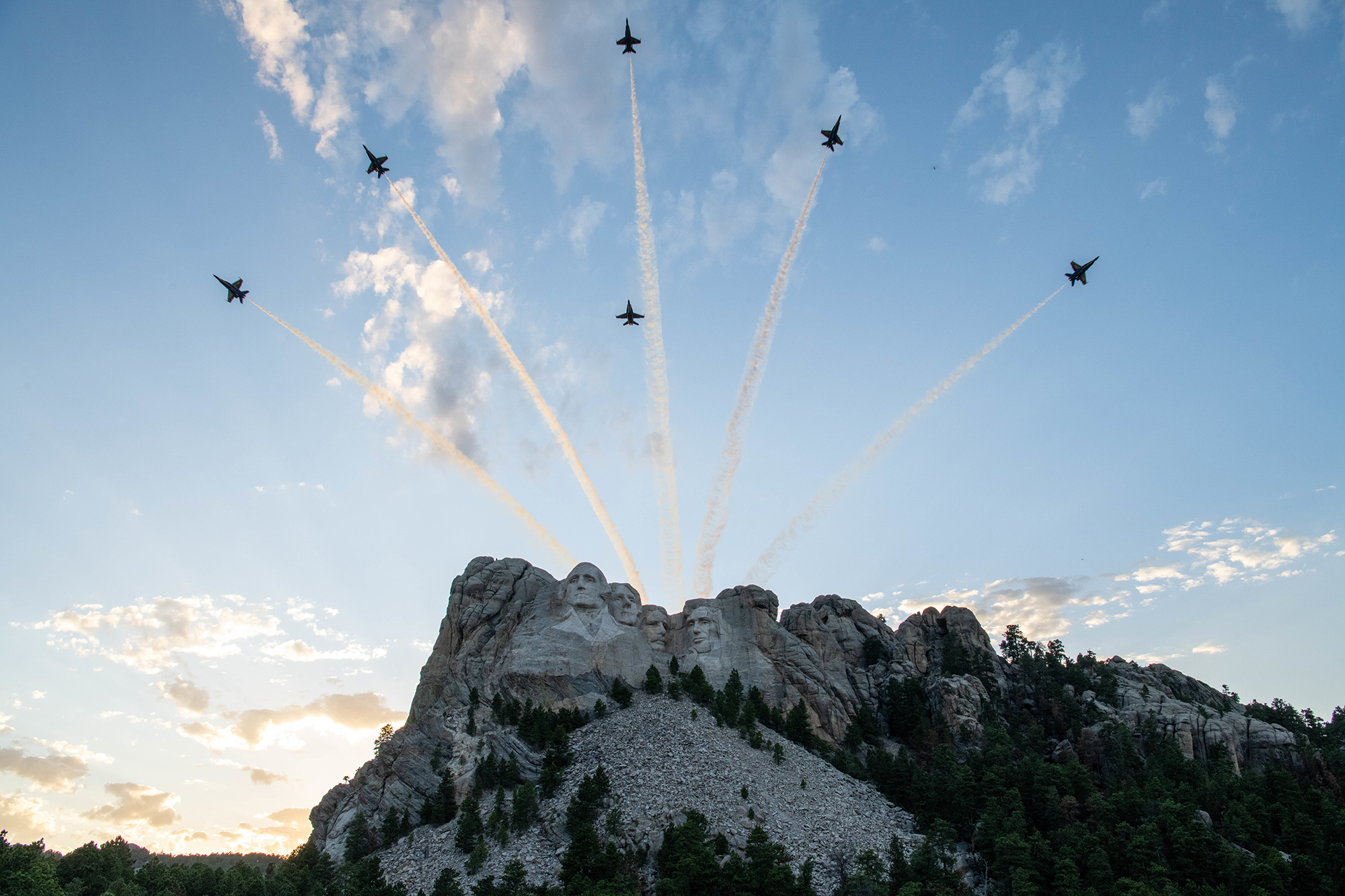 Blue Angels F-18 Hornets fly over Mount Rushmore during a