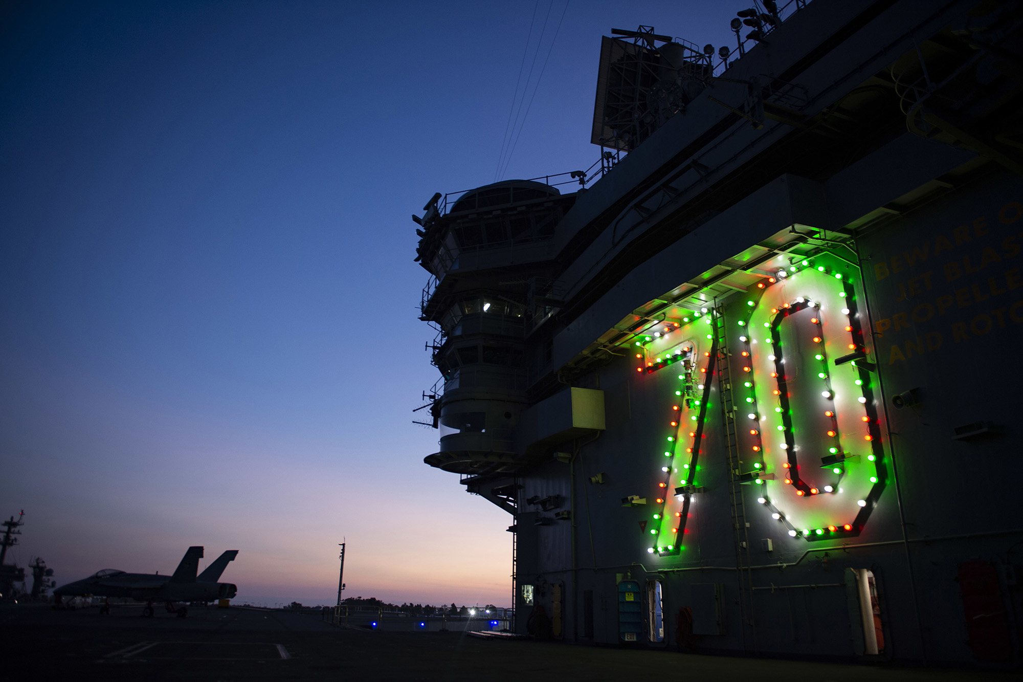 The Nimitz-class nuclear aircraft carrier USS Carl Vinson (CVN 70) displays holiday lights on the island in celebration of the holiday season on Nov. 26, 2020, in San Diego. (MC2 Matthew A. Fink/Navy)