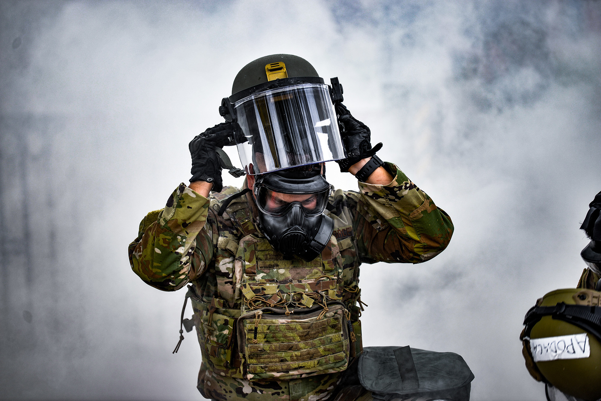 Tech. Sgt. Estevan Jojola puts on his face shield during a training exercise in Albuquerque, N.M., Aug. 17, 2020. (Senior Airman Ian Beckley/Air Force)