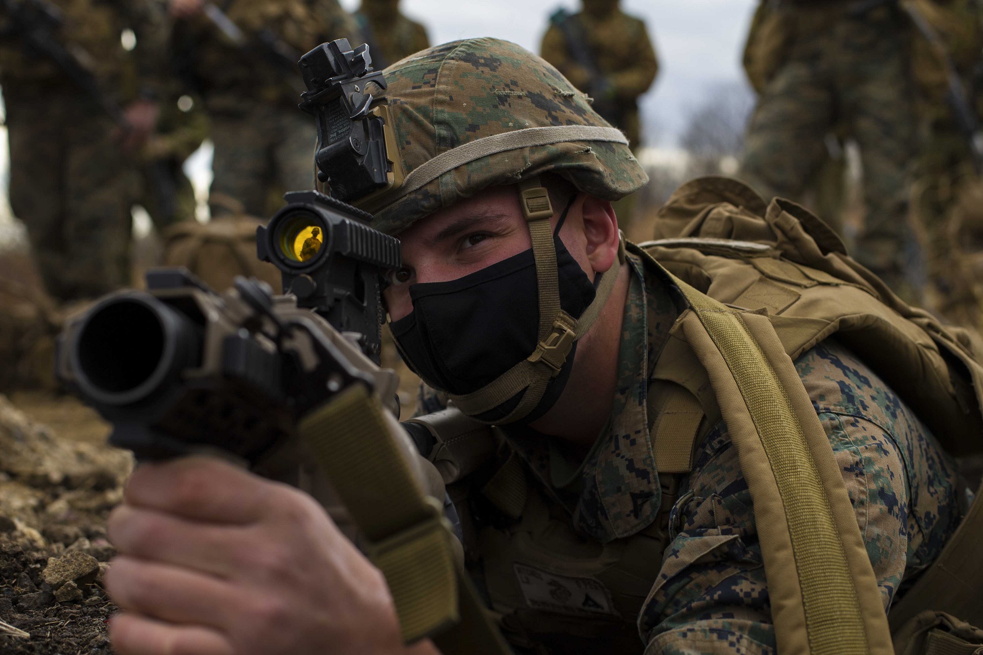 Marine Corps Lance Cpl. Lucas Mitchell looks through the scope of an M32 multi-grenade launcher in Niigata, Japan, Dec. 10, 2020, during Forest Light, an annual bilateral exercise with U.S. and Japanese forces. (Lance Cpl. Jonathan Willcox/Marine Corps)