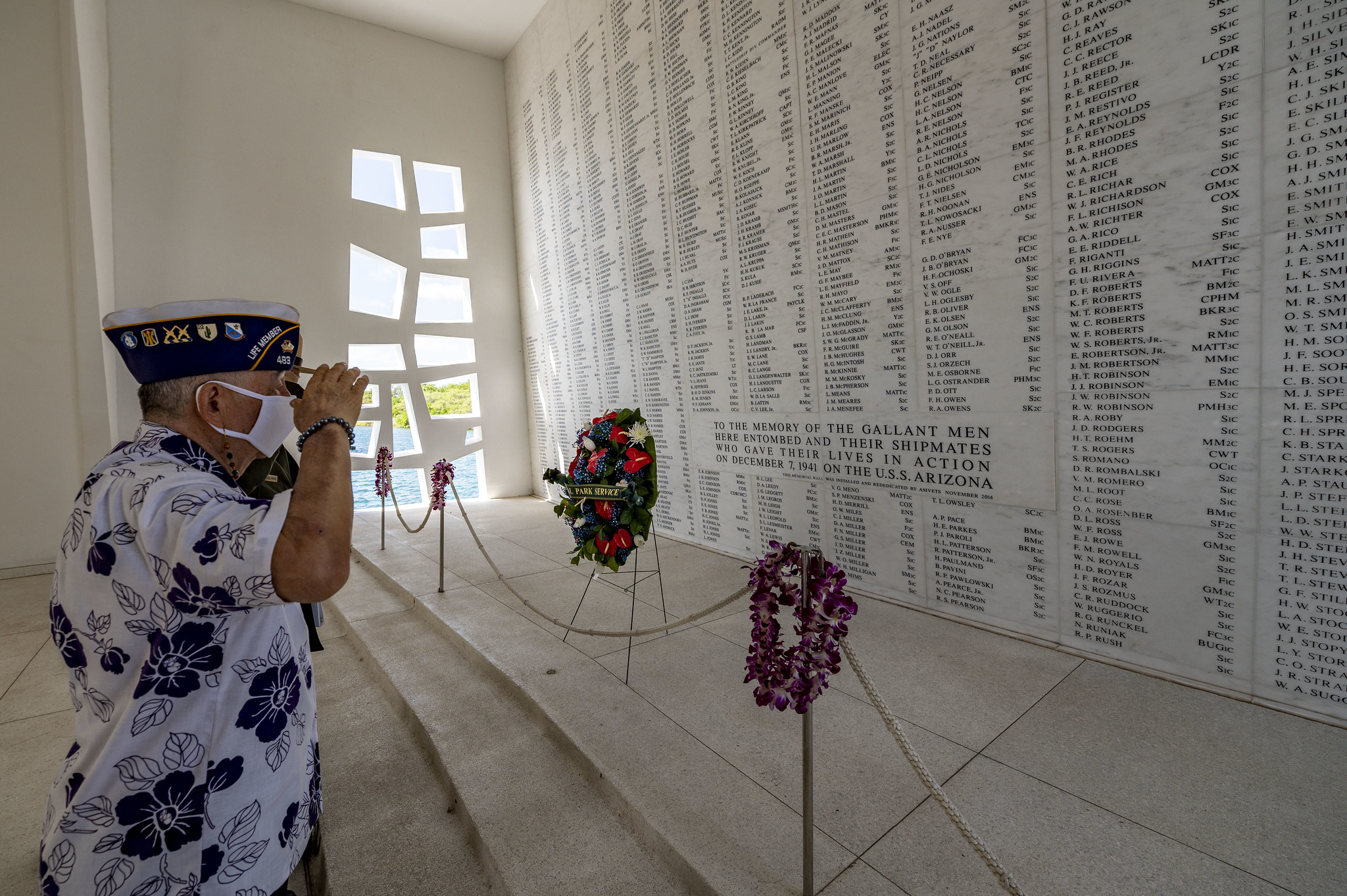 Henry Lee, a Pearl Harbor survivor and U.S. Army veteran, renders honors in the USS Arizona Memorial shrine room on Dec. 7, 2020, as part of the 79th Pearl Harbor Day Remembrance Day ceremony in Honolulu, Hawaii. (MC2 Charles Oki/Navy)