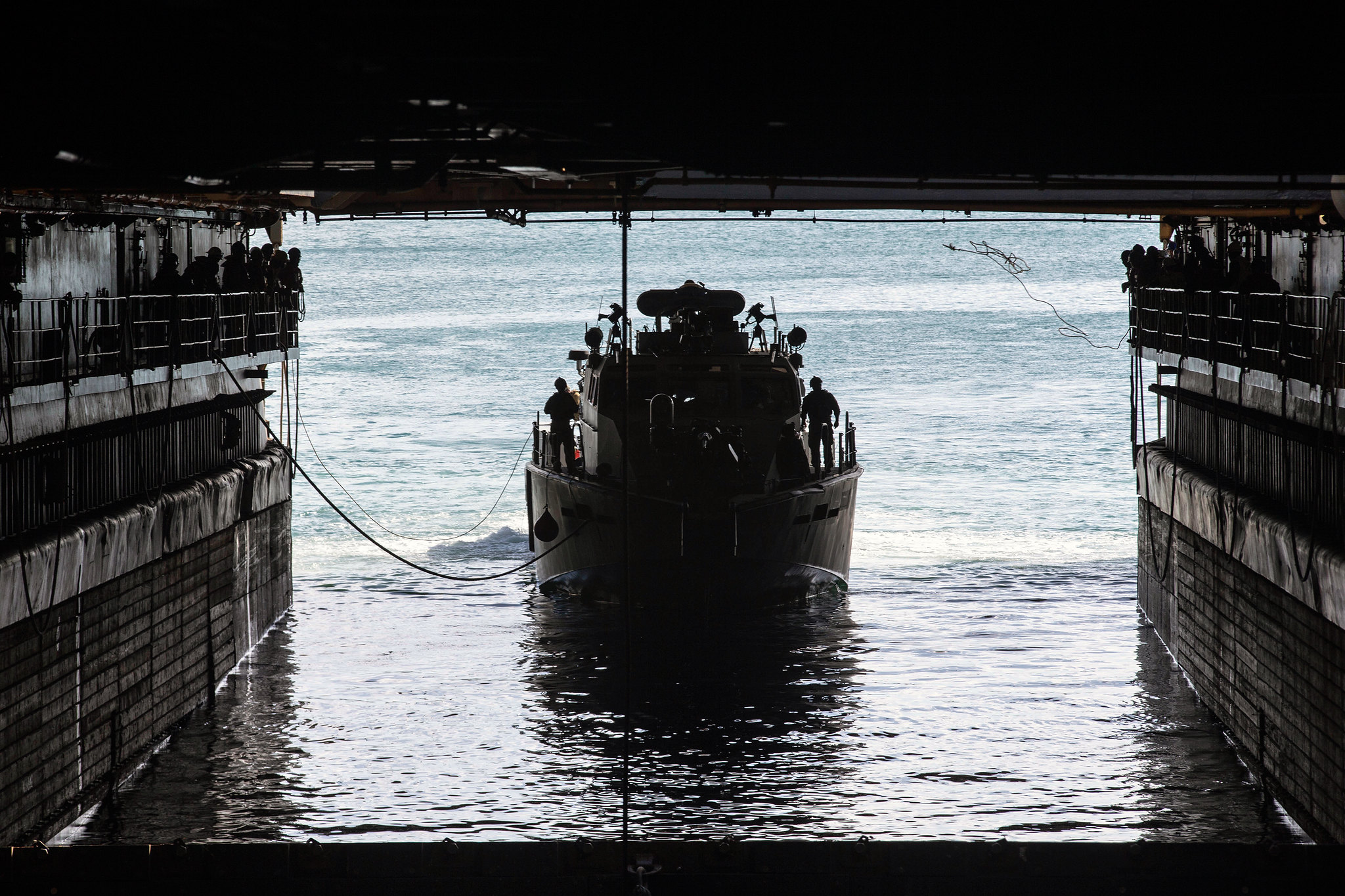 A U.S. Navy Mark VI patrol boat navigates into the well deck of dock landing ship USS Ashland (LSD 48) at Naval Base Guam, Feb. 21, 2021. (Sgt. Danny Gonzalez/Marine Corps)