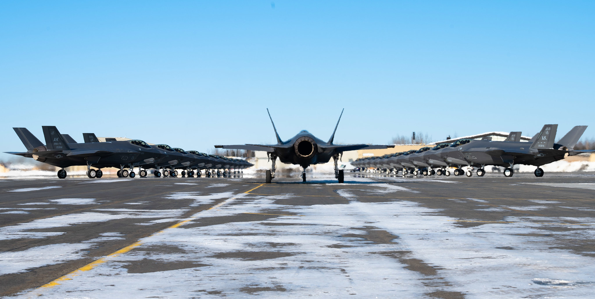 Twenty-five F-35A Lightning IIs assigned to the 354th Fighter Wing assemble on the flightline prior to taking off during Arctic Gold (AG) 21-2 at Eielson Air Force Base, Alaska, April 7, 2021. (Airman 1st Class Jose Miguel T. Tamondong/Air Force)