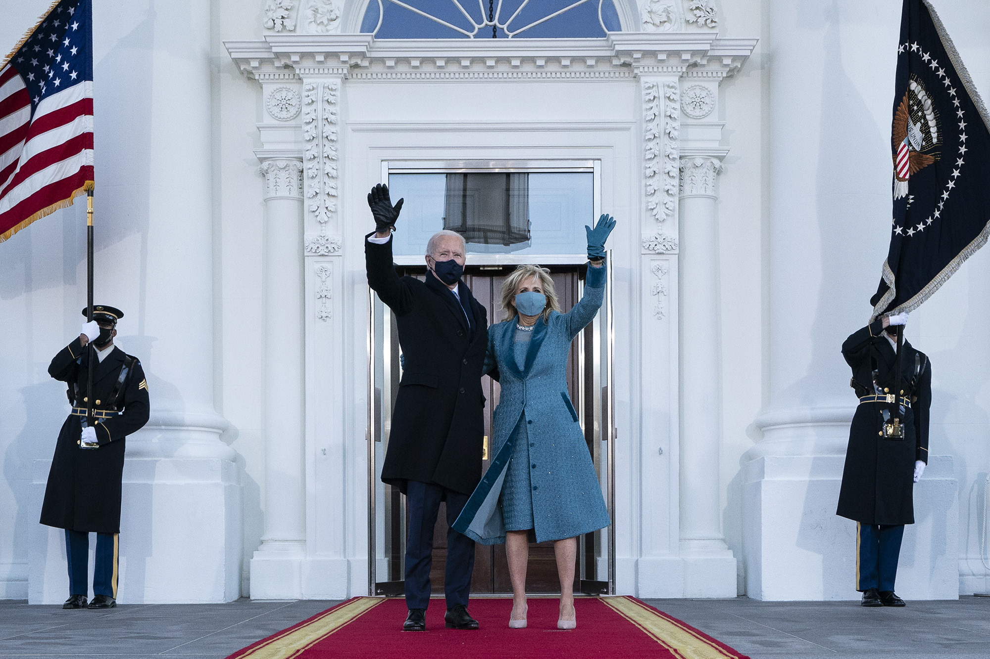 President Joe Biden and first lady Jill Biden wave as they arrive at the North Portico of the White House, Wednesday, Jan. 20, 2021, in Washington. (Alex Brandon/Pool via AP)