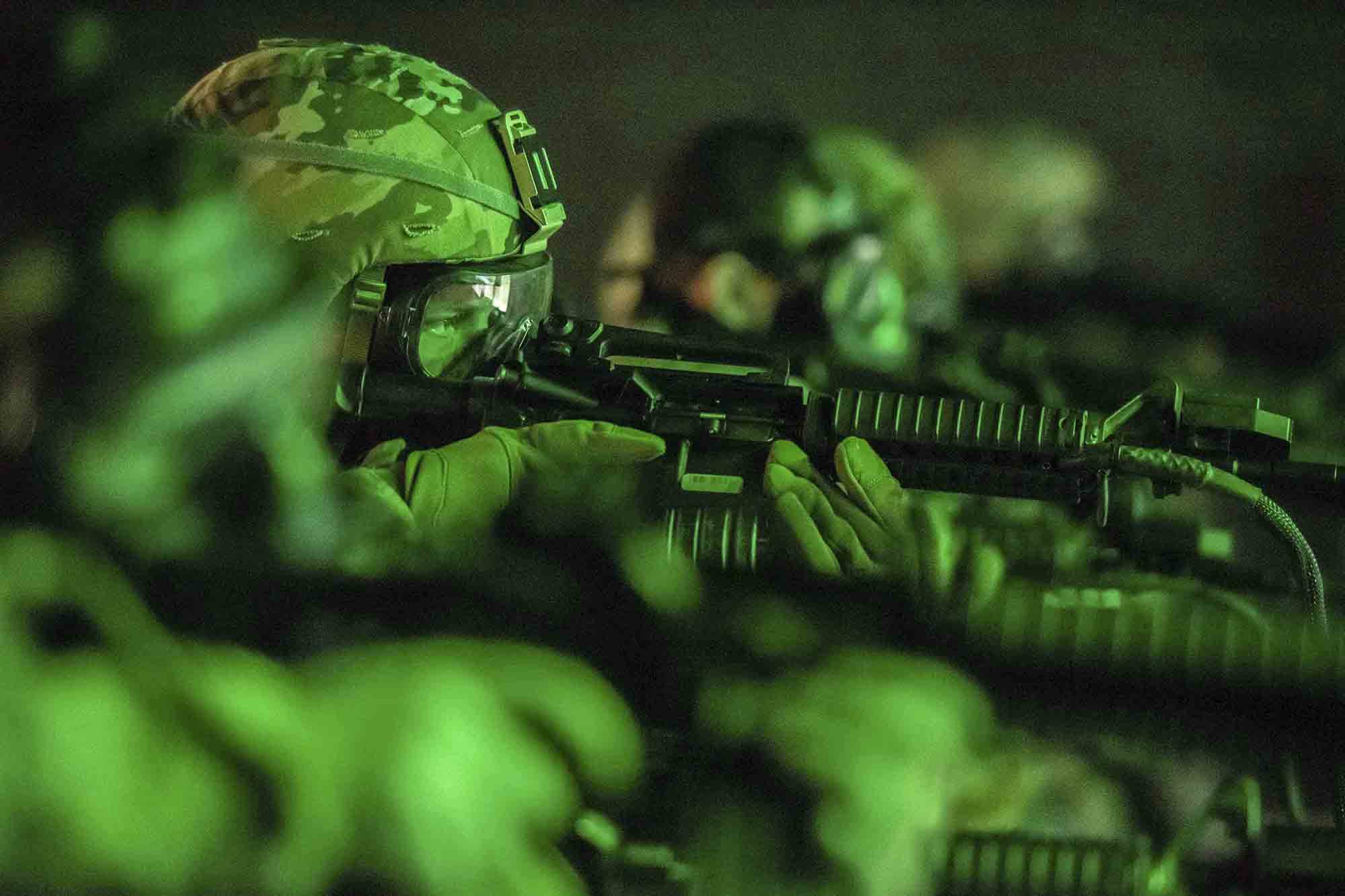 Army Reserve soldiers with the 811th Hospital Center, 139th Medical Brigade, complete their mobilization training using M4 weapons trainers Feb. 9, 2021, at the Engagement Skills Trainer in the 200 block at Fort McCoy, Wis. (Army)
