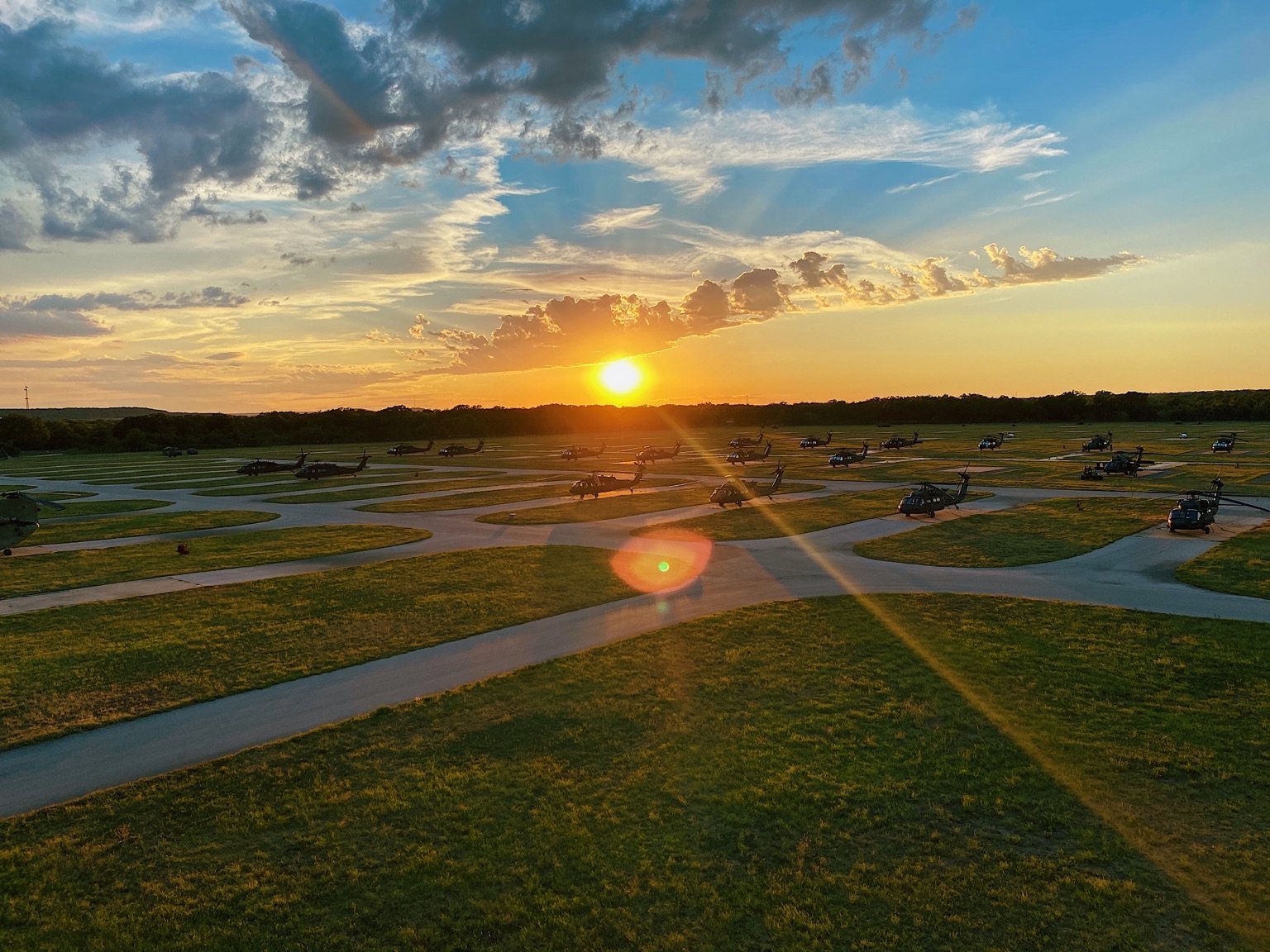 The sun sets behind an airfield at the 28th Expeditionary Combat Aviation Brigade's mobilization station at Fort Hood, Texas. (Staff Sgt. Breanna Chase/Army)