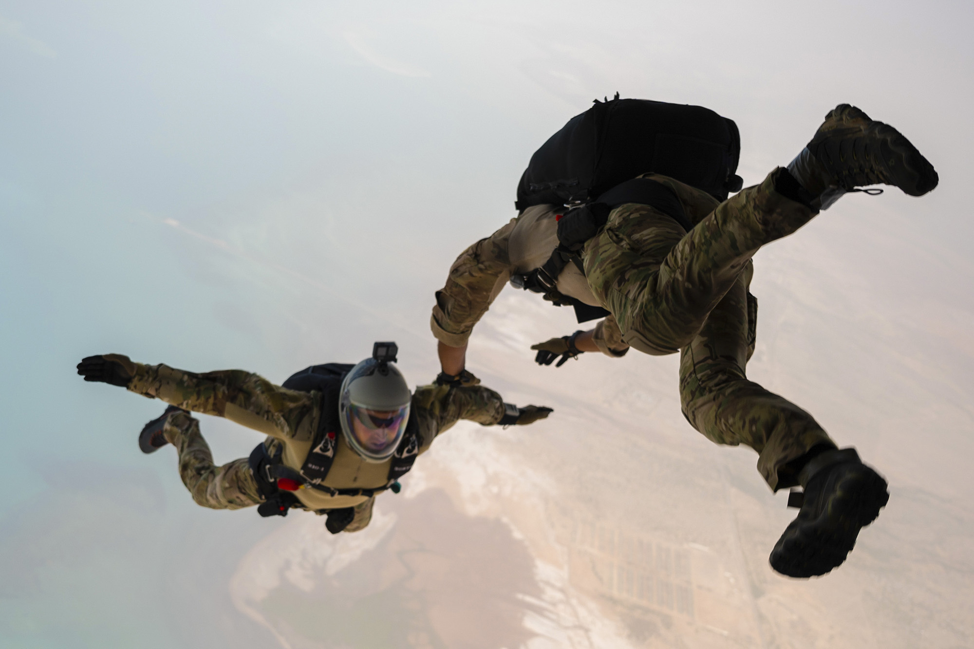 U.S. Air Force special warfare airmen assigned to the 82nd Expeditionary Rescue Squadron perform static line and military free fall jumps from a KC-130J over Djibouti, June 21, 2021. (Tech. Sgt. Daniel Asselta/Air Force)