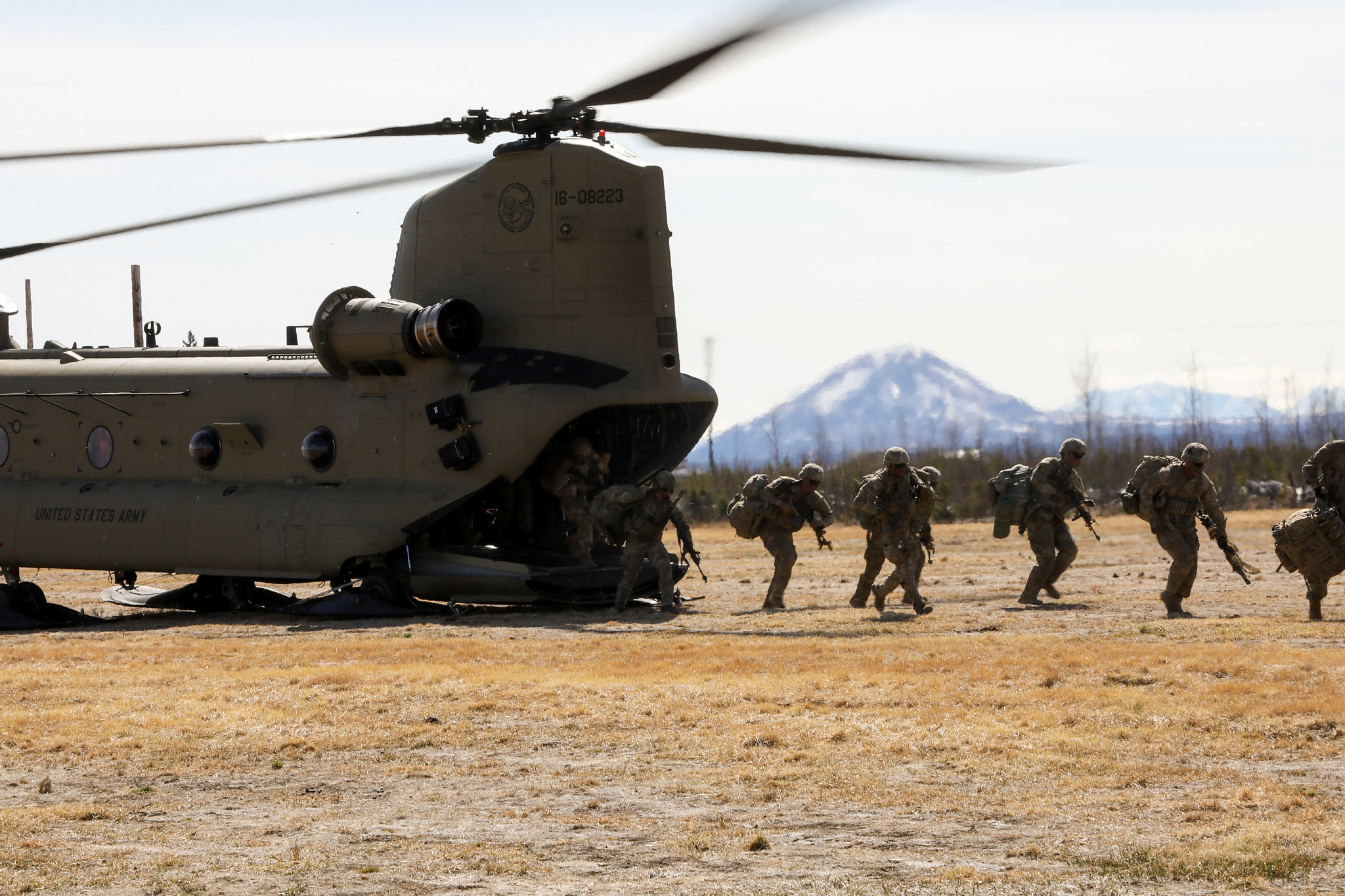 Paratroopers exit a CH-47 Chinook on May 10, 2021, as they conduct an air assault during exercise Northern Edge 21 at Fort Greely, Alaska. (Staff Sgt. Alex Skripnichuk/Army)