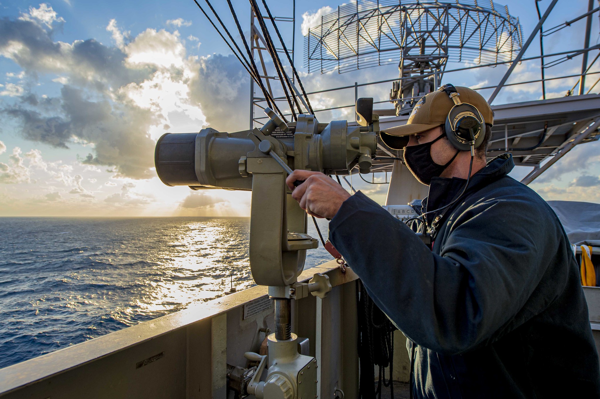 Seaman Cedric Volle stands aft lookout watch aboard the Nimitz-class aircraft carrier USS Dwight D. Eisenhower (CVN 69) in the Mediterranean Sea, April 1, 2021. (Mass Communication Specialist Seaman Jacob Hilgendorf/Navy)