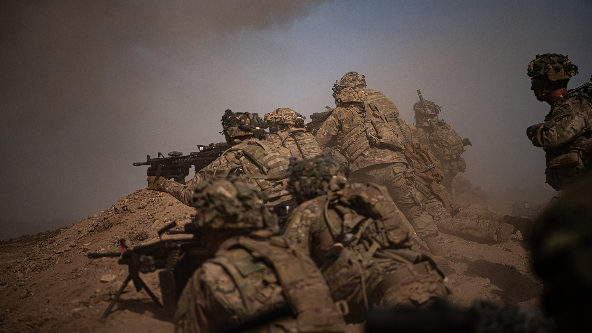 U.S. Army paratroopers move up on a berm to provide security for the assaulting element on July 29, 2020, during a company live fire exercise as part of the 173rd Brigade Field Training Exercise in Grafenwoehr Training Area, Germany from July 17 to Aug. 5, 2020. (Sgt. John Yountz/Army)